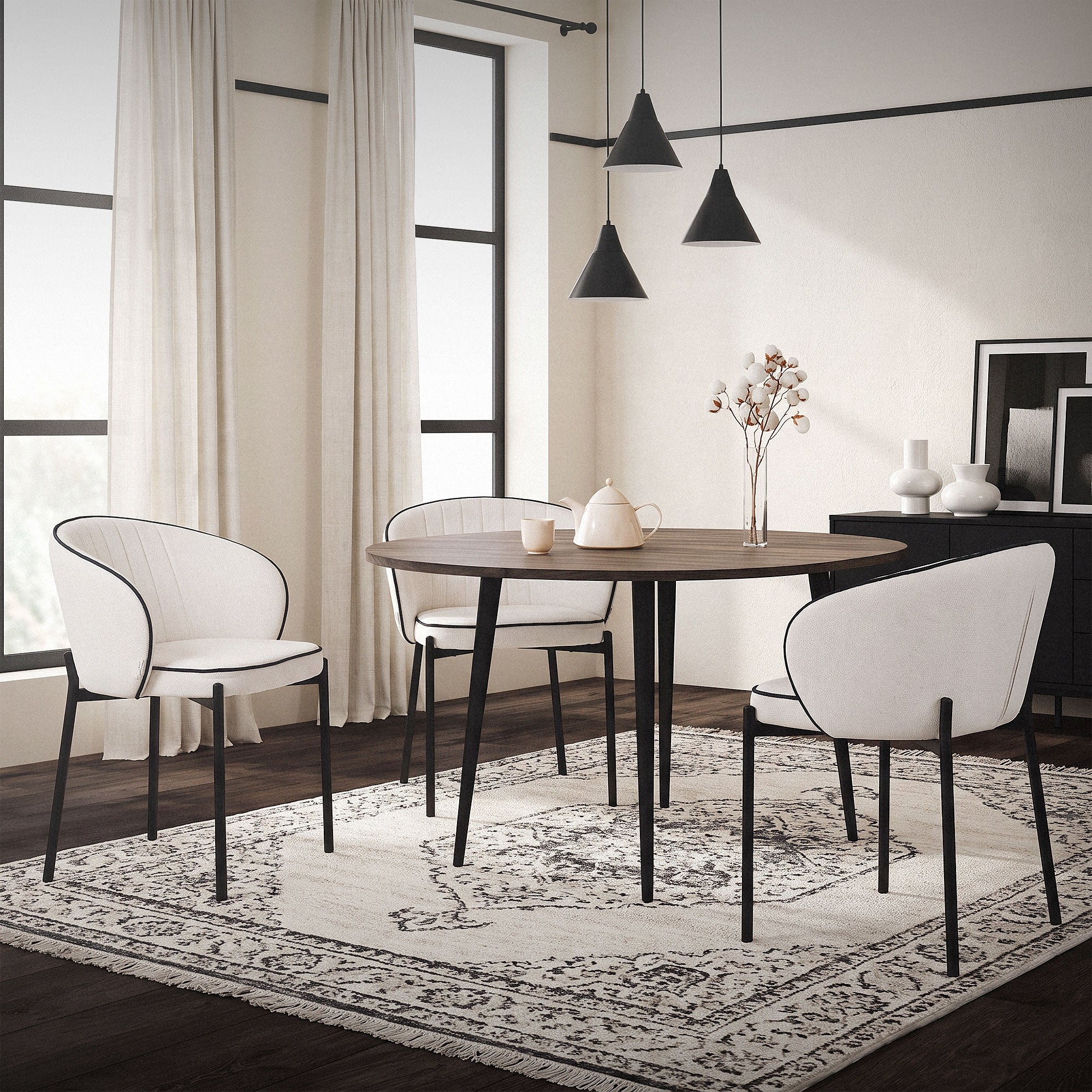 Dining room with three chairs around a table, bright windows and decoration.