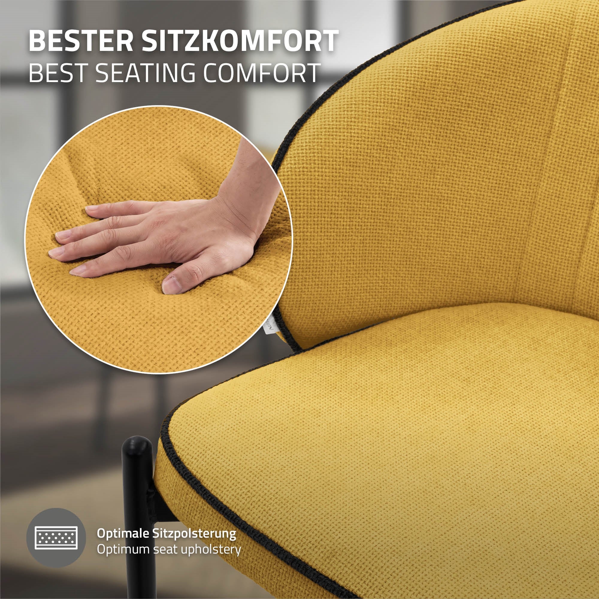Close-up of a hand pressing on a yellow chair to show seating comfort.