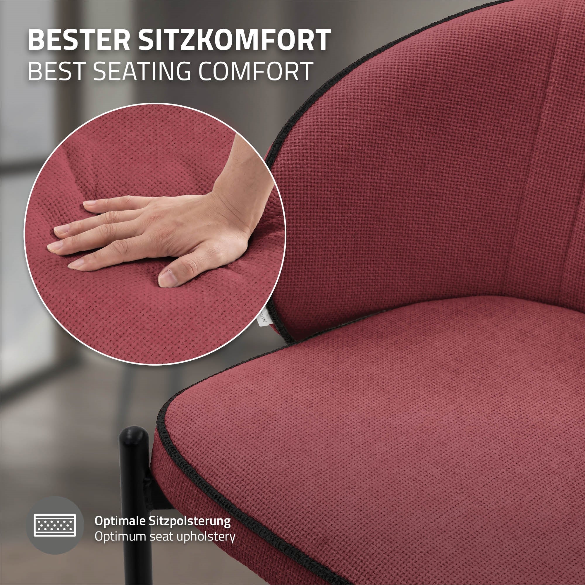 Nahaufnahme eines Stuhls mit rotem Bezug und Hand auf der Sitzfläche.