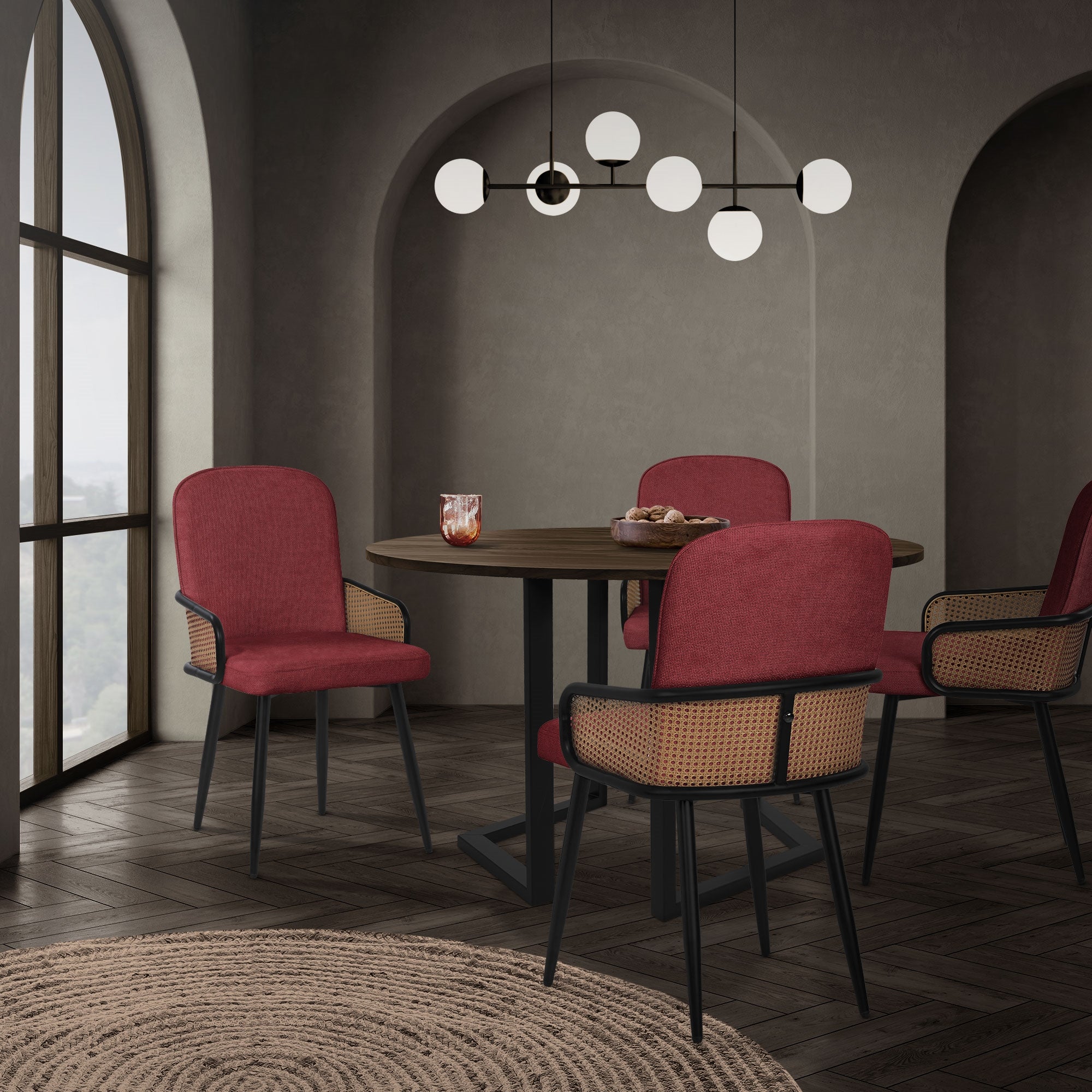 Round table with red chairs in a stylish dining room.