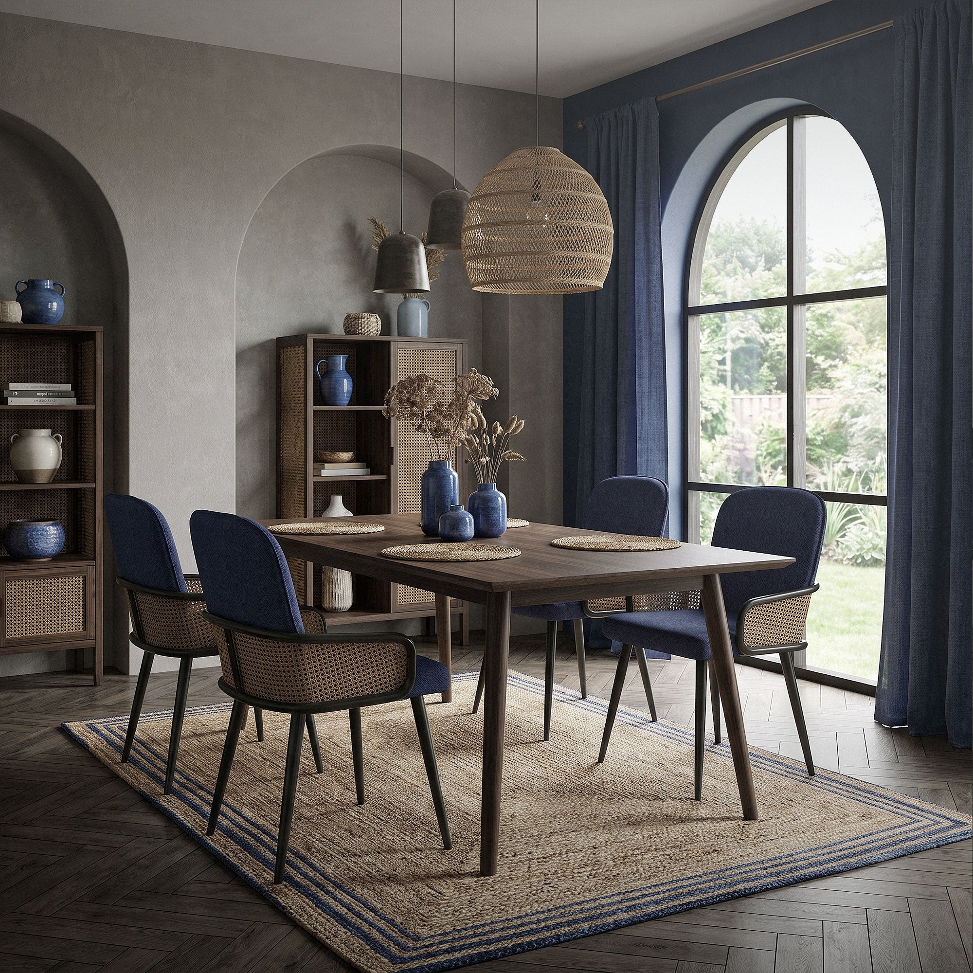 Dining room with table and chairs, large windows, and decorative elements.