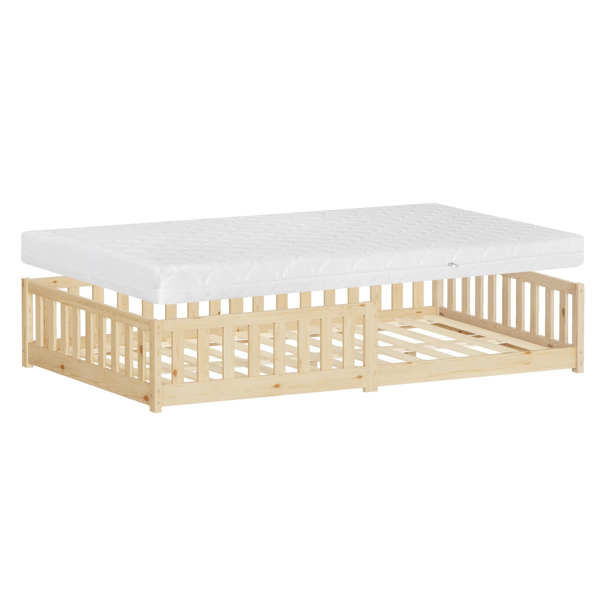 A children's bed with mattress, on a light floor, with a slatted frame.