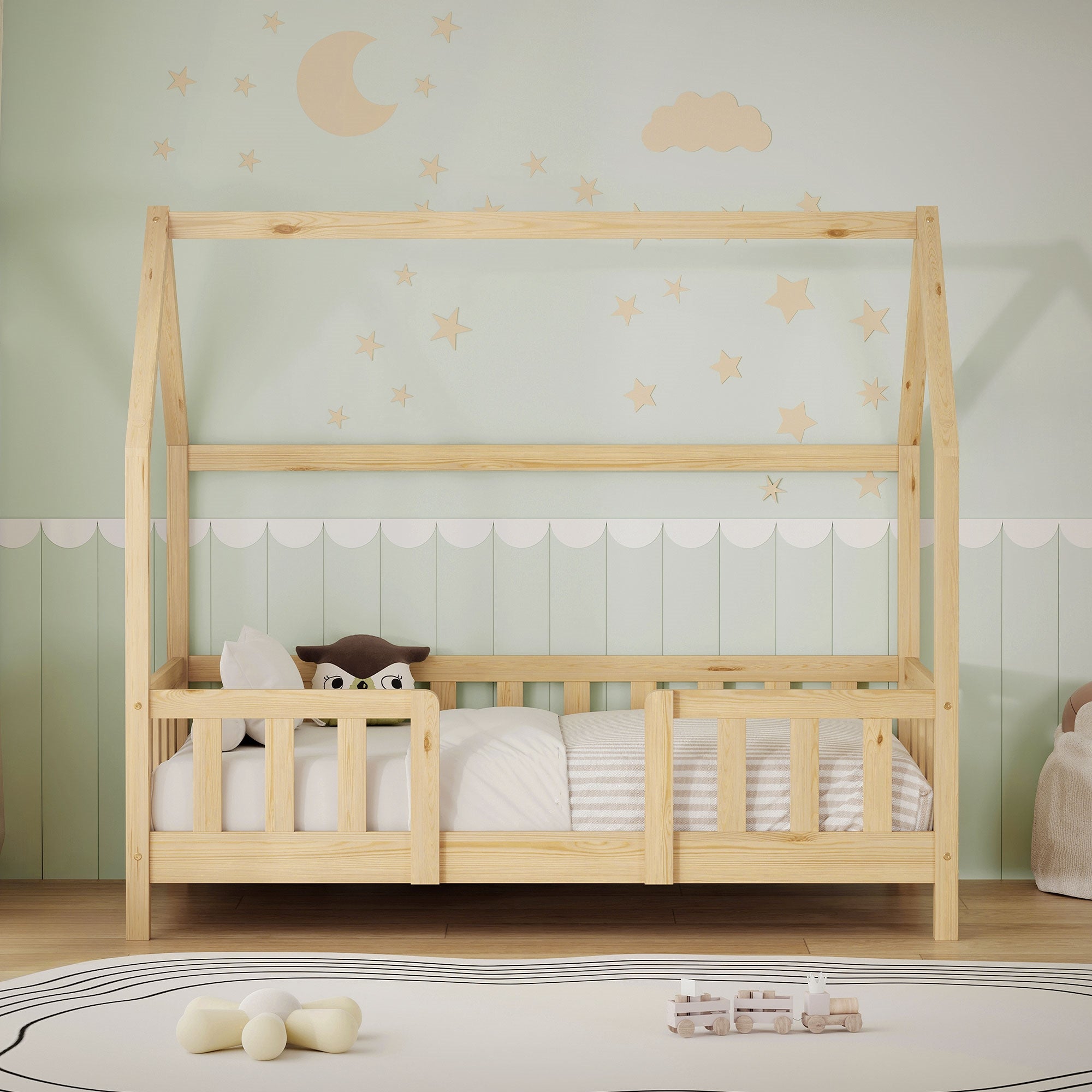 Cama infantil de madera en estilo escandinavo con estrellas y luna en la pared.