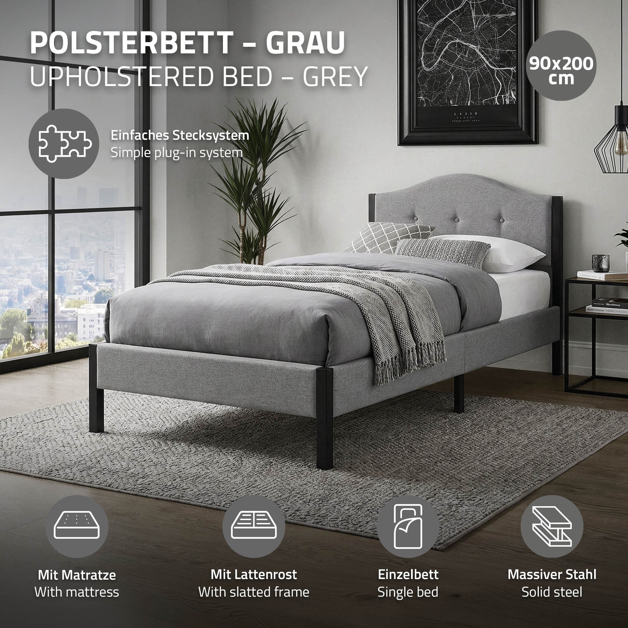 Graues Polsterbett mit Matratze und Lattenrost auf einem Teppich.