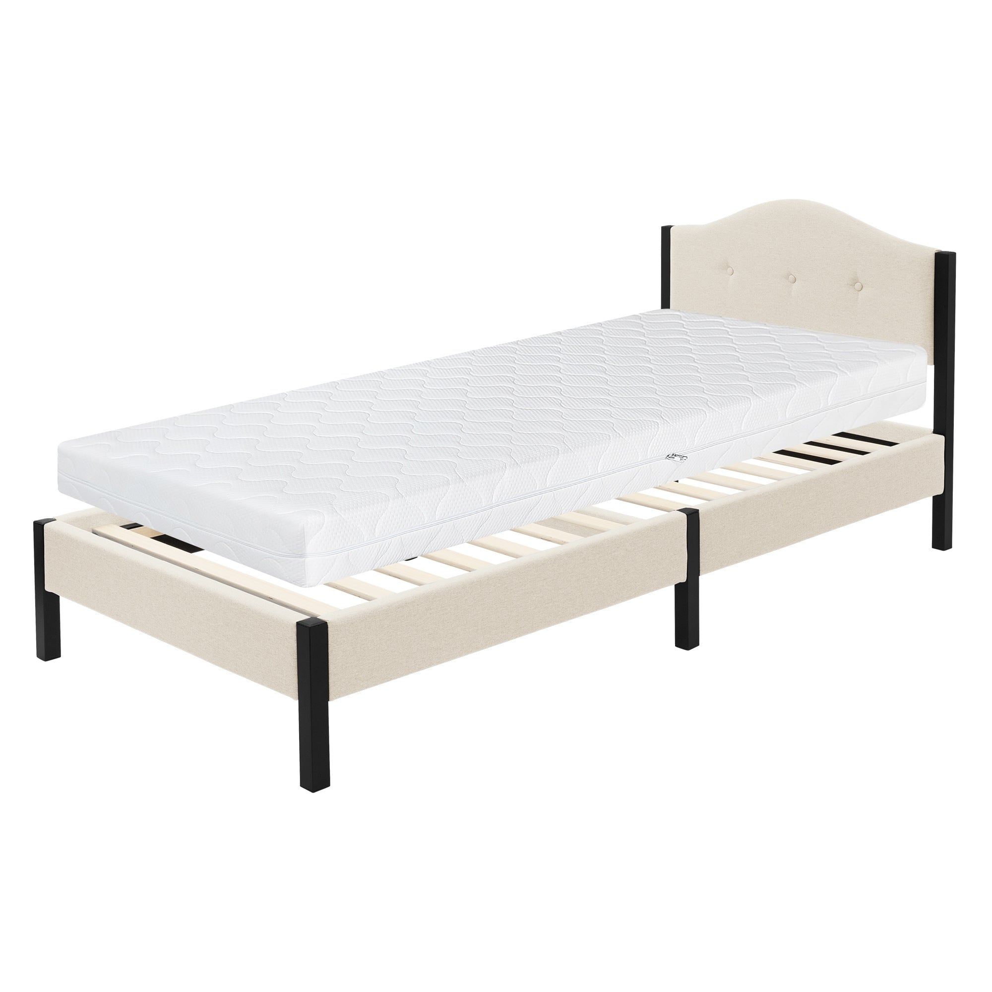 Ein einzelnes Bett mit einer Matratze und einem gepolsterten Kopfteil.