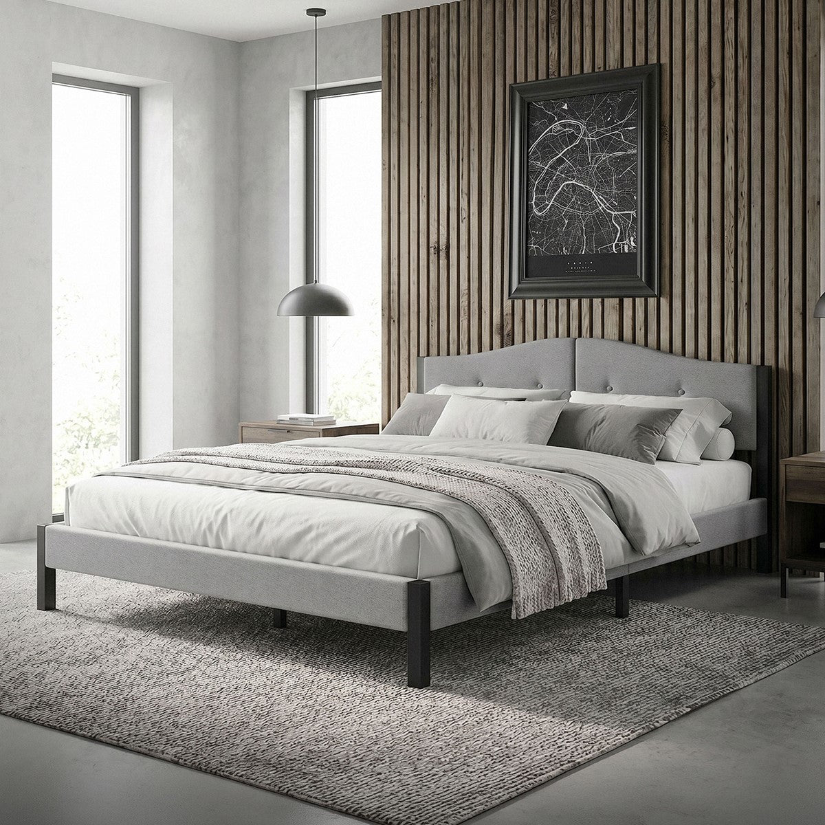 Bedroom with a bed, rug and wood paneling on the wall.