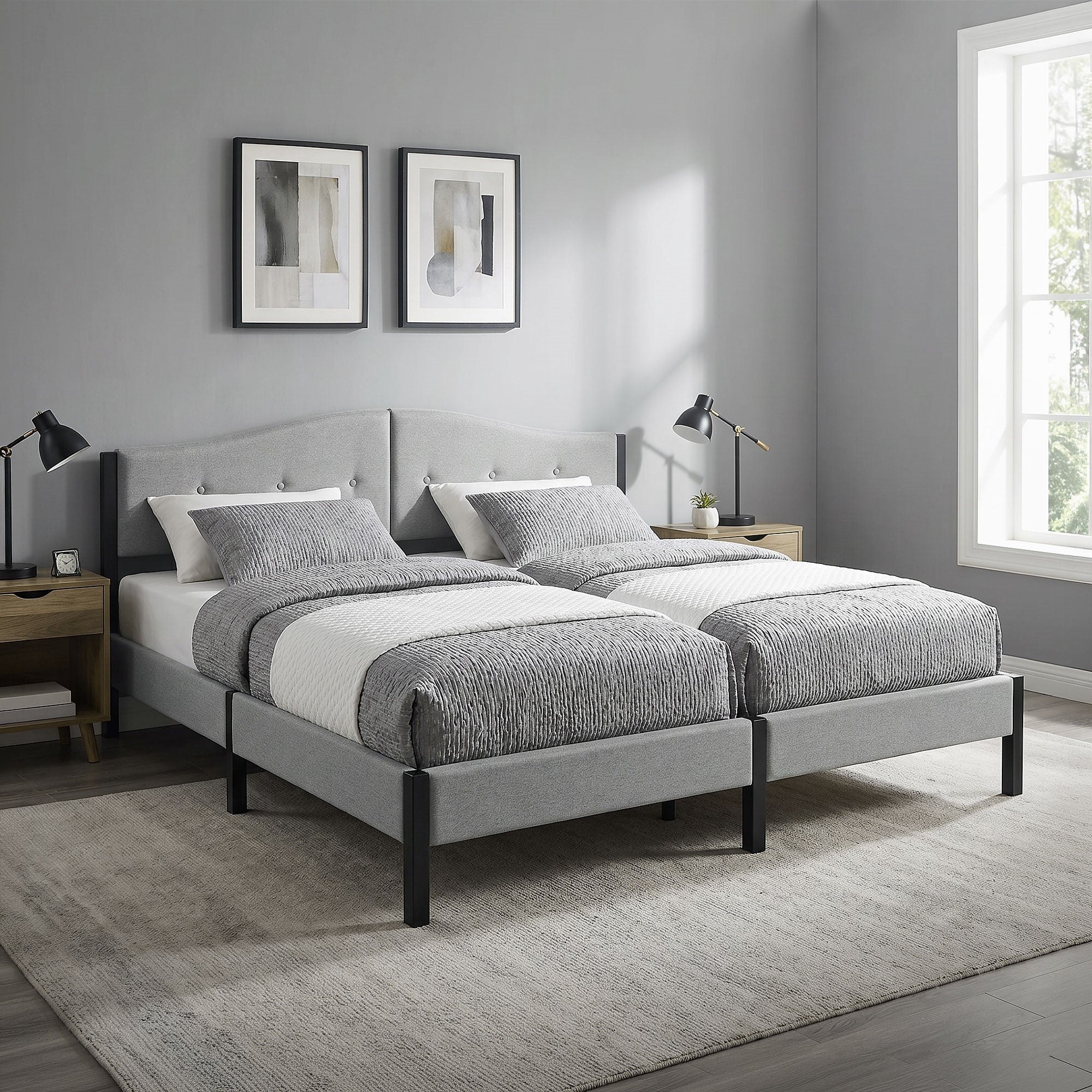 Two single beds with gray bedding in a modern bedroom.