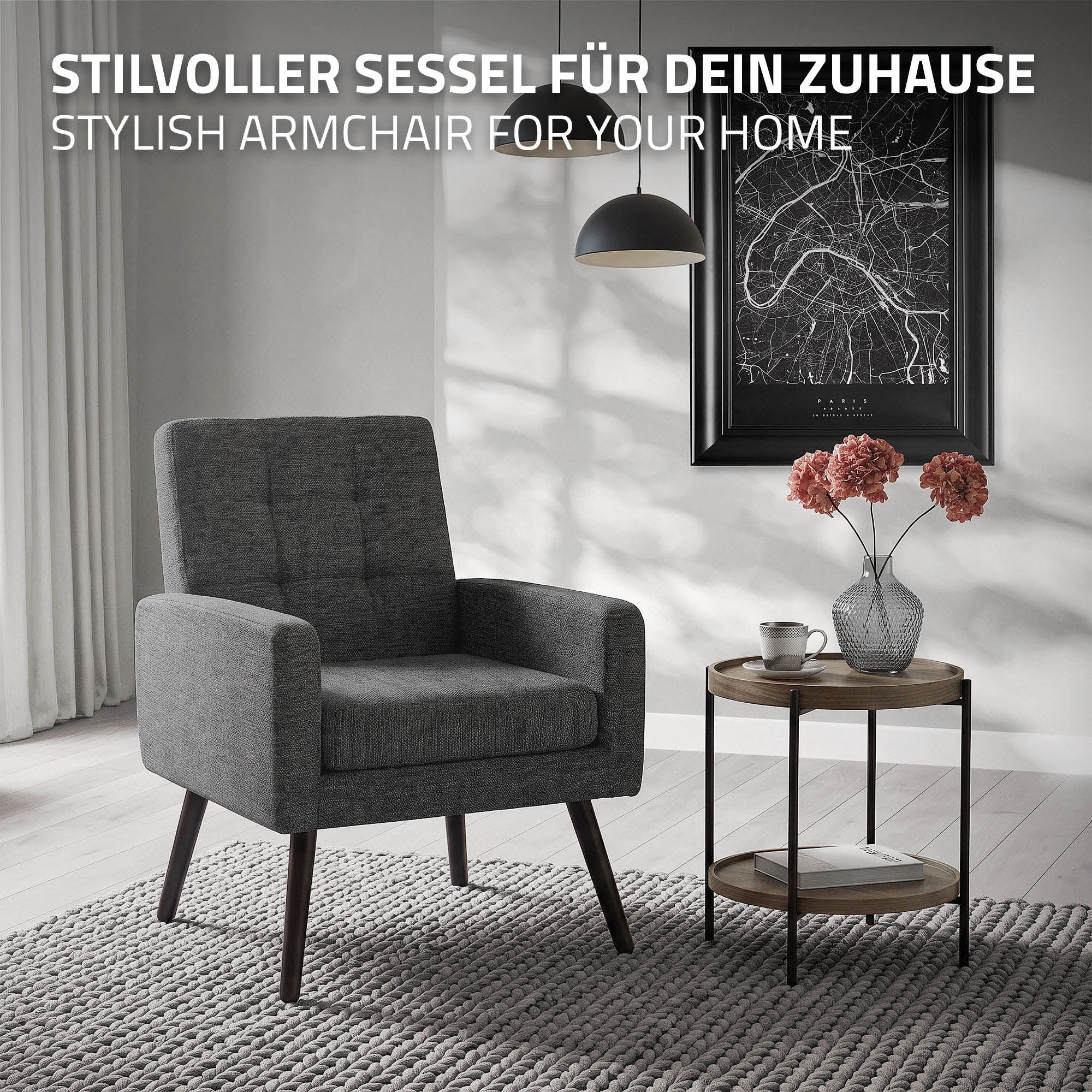Grauer Sessel neben einem Beistelltisch mit Blumen und einer Lampe in einem modernen Raum.