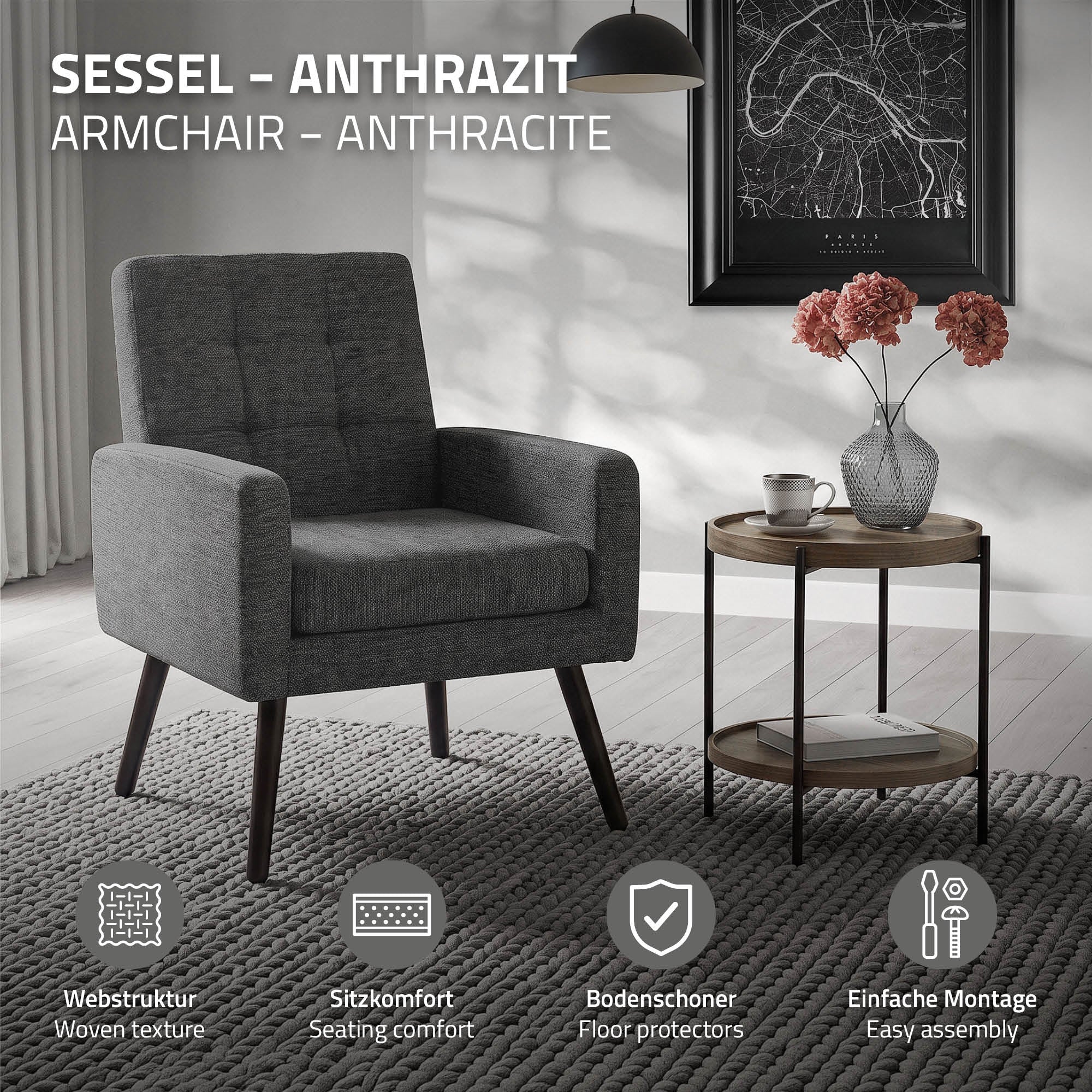 Anthrazitfarbener Sessel mit Webstruktur und Tisch, Blumen in Vase.