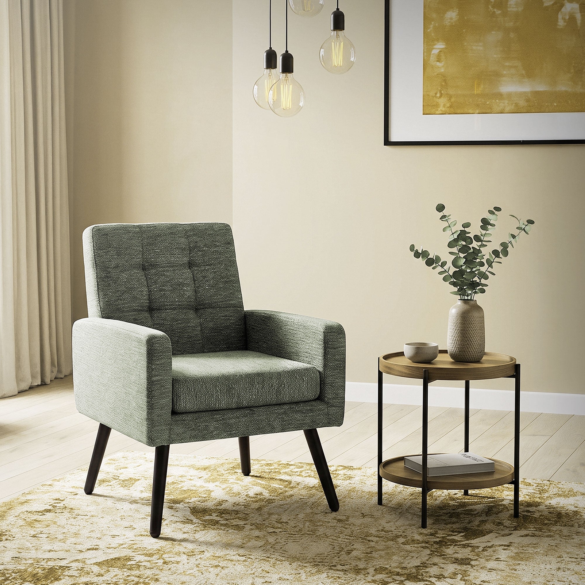 Gray armchair next to a side table and a plant.