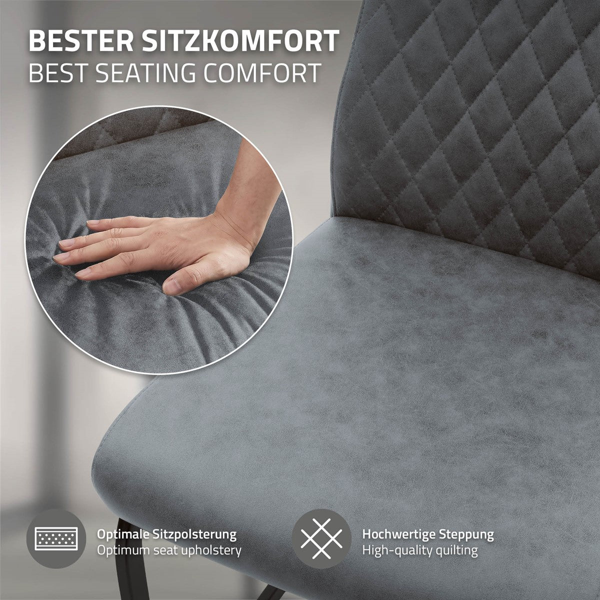 Nahaufnahme einer grauen, gepolsterten Sitzfläche mit rautenförmig gesteppter Rückenlehne; eine Hand drückt auf das Polster.