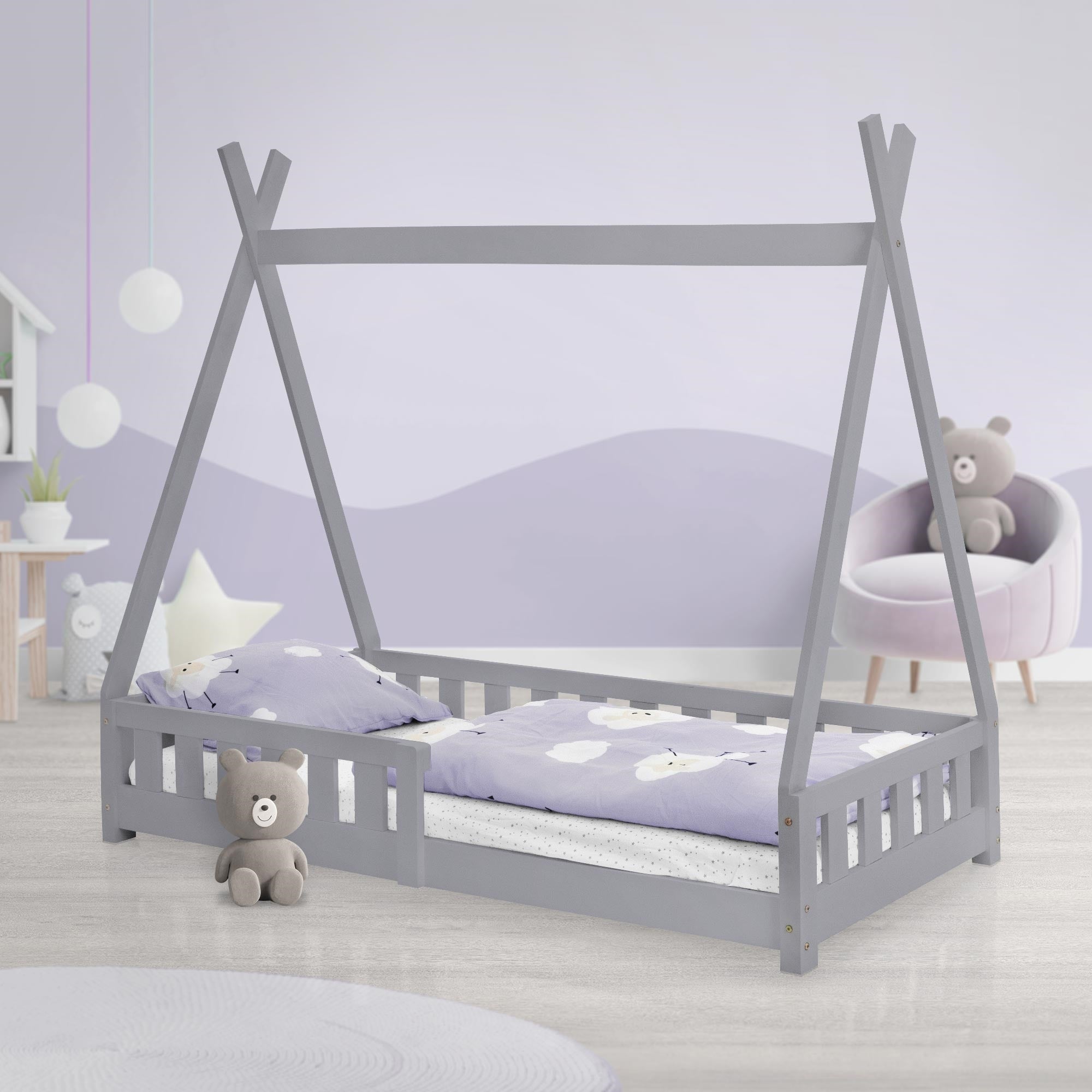 A gray children's bed in tent style with pillow and blanket in the room.