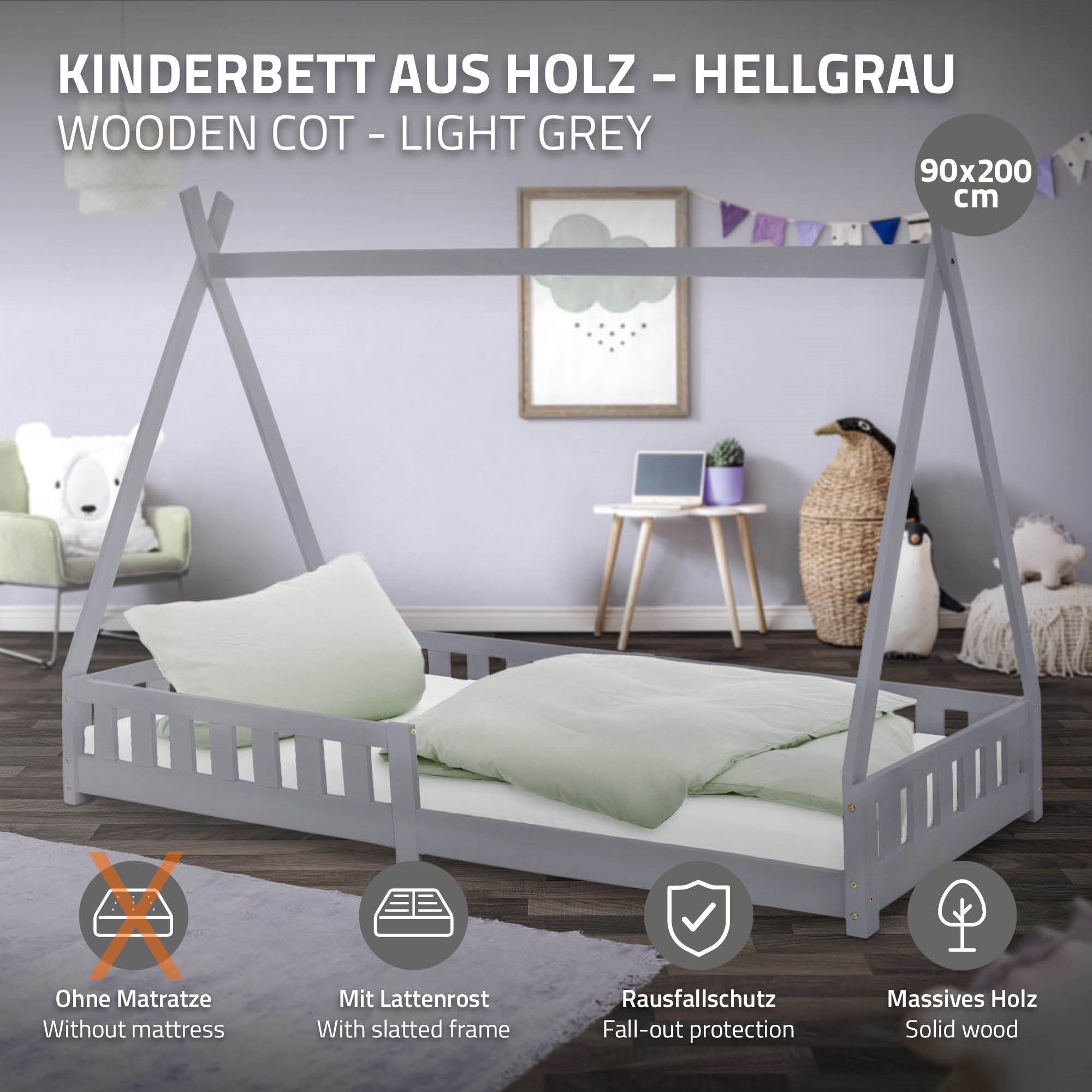 Kinderbett aus Holz in hellgrau mit zwei Kissen und Matratze.
