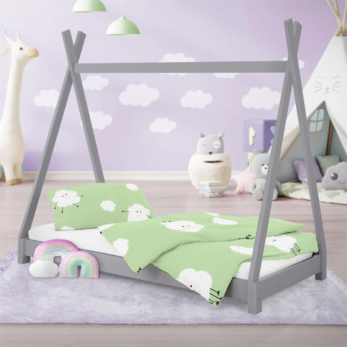 Children’s bed in a room with toys and decorations.