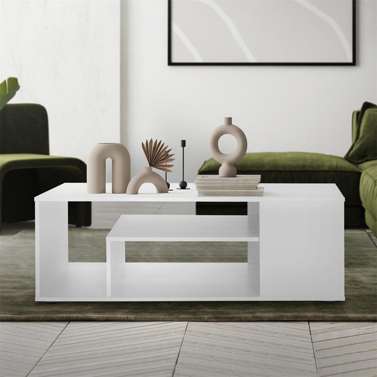 Modern coffee table with decorative objects on a green rug.