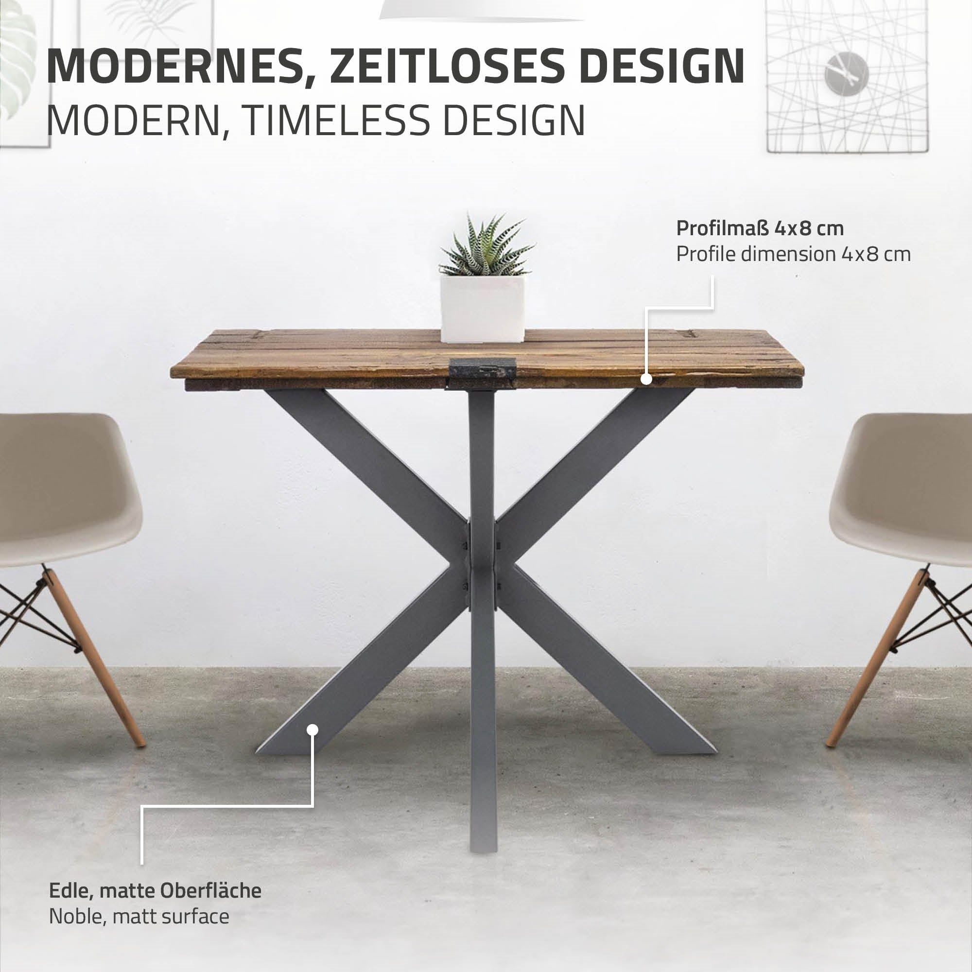 Holztisch mit X-förmigem Metallgestell und edler, matter Oberfläche.