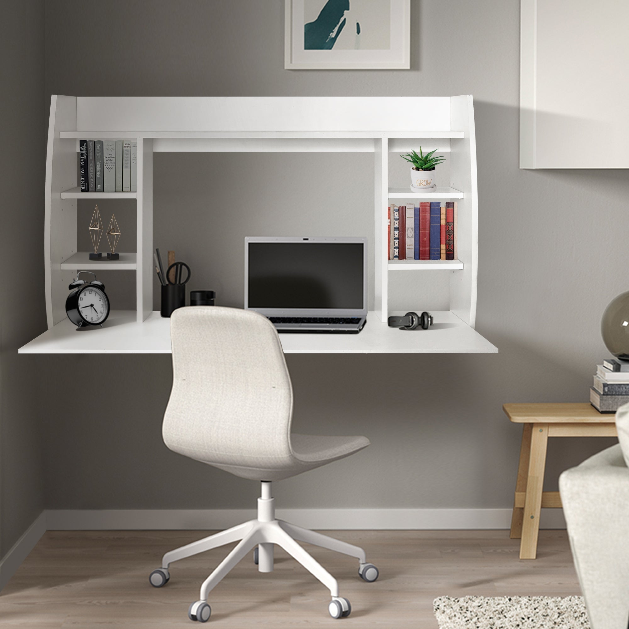 White desk with a laptop, chair, and shelves in a modern room.