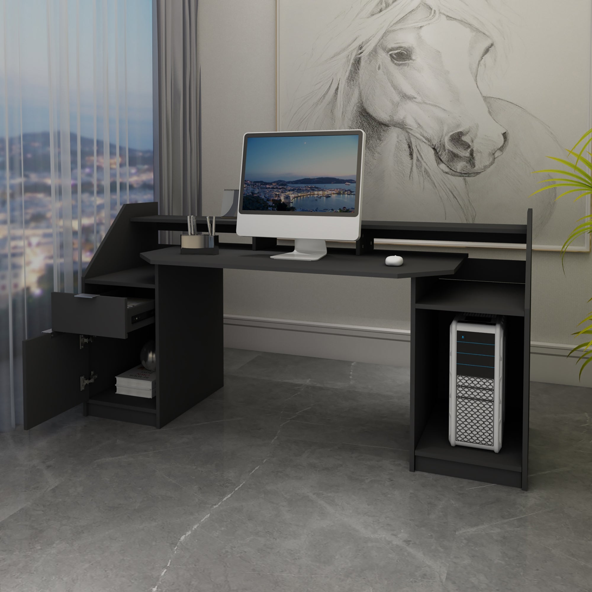 Black desk with computer, drawer, and plants, in front of a window.