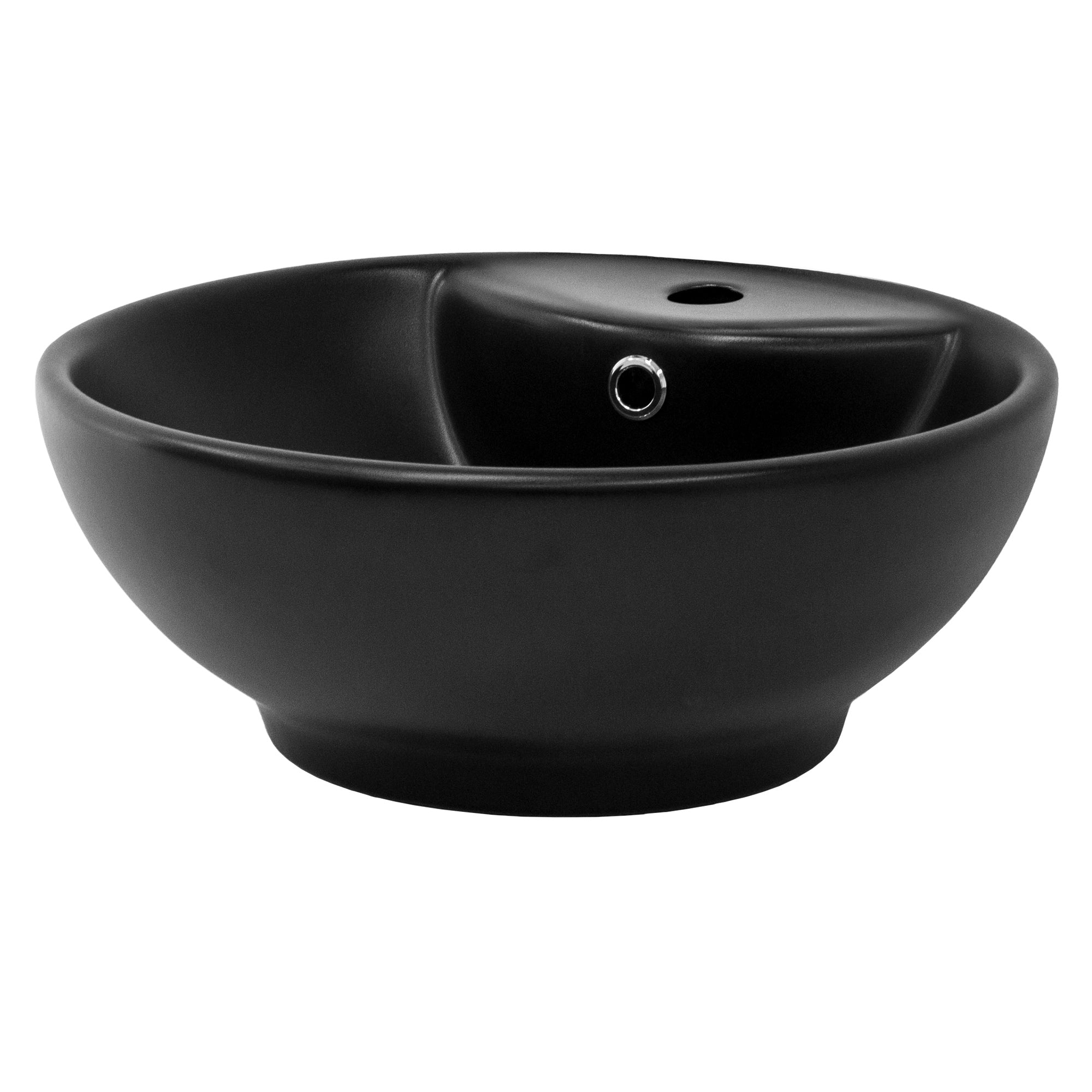 Black round wash basin with a small hole for water drainage.