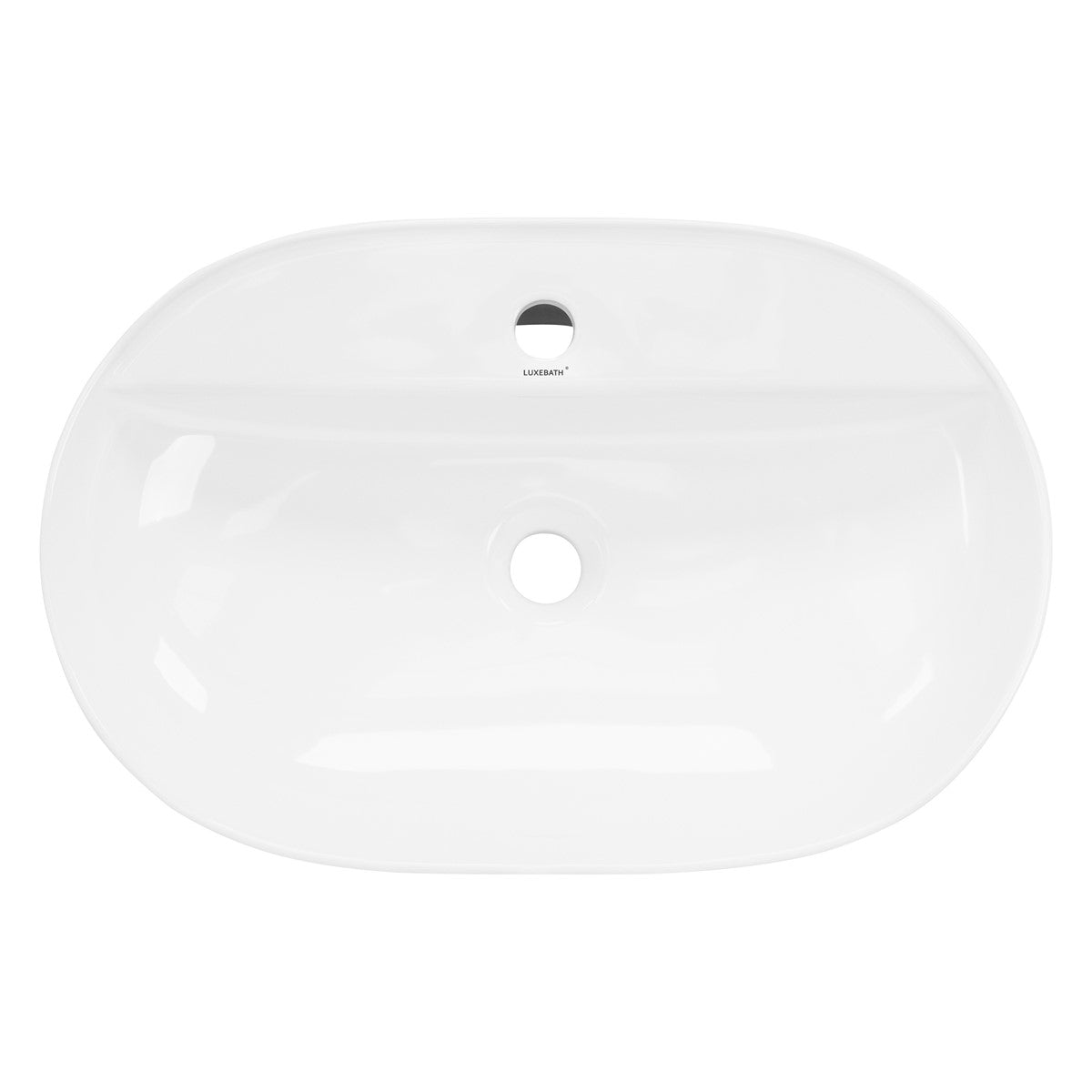 Top view of a white washbasin with a centrally positioned drain hole.