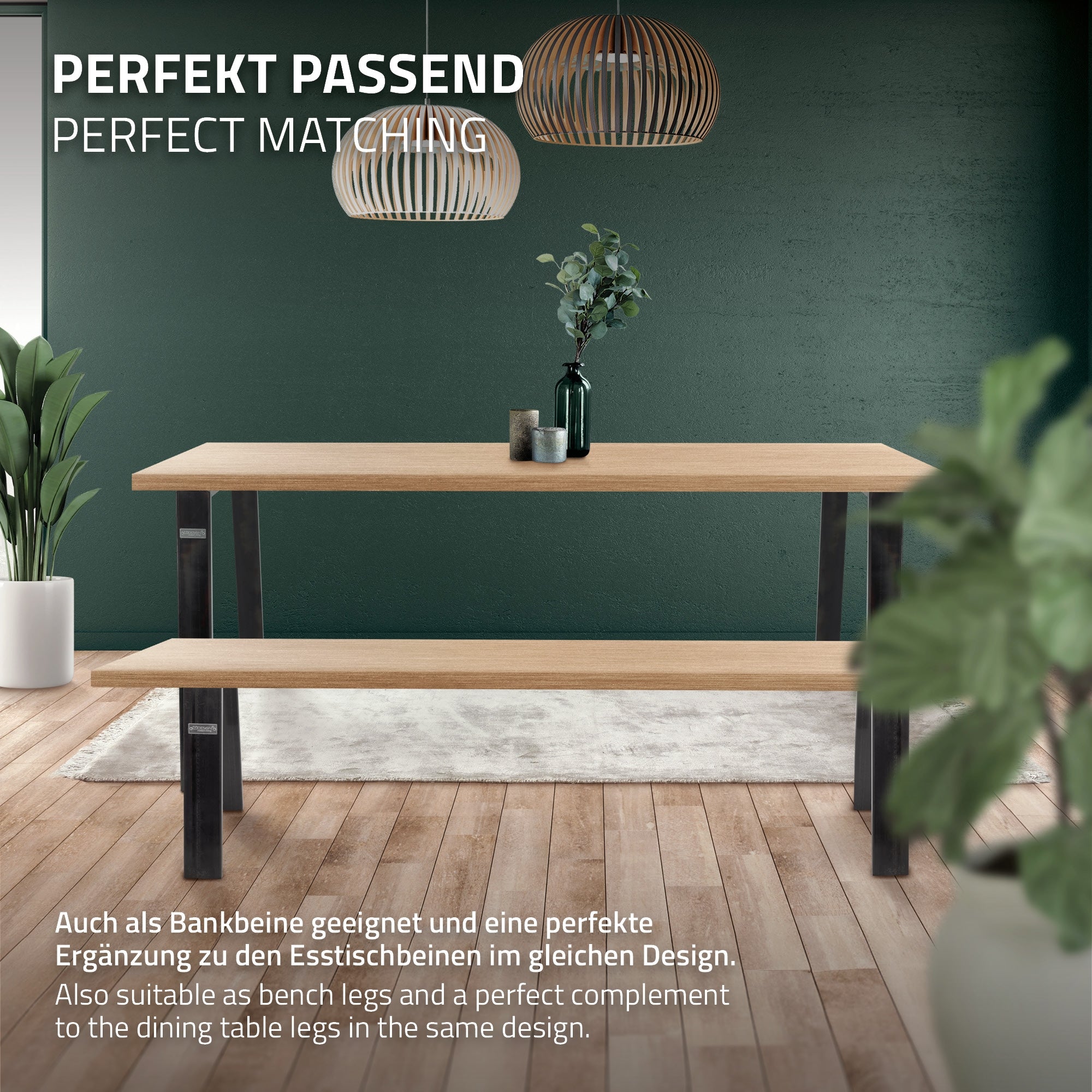 Træbord med sorte ben, dekoreret med en plante og moderne lamper.
