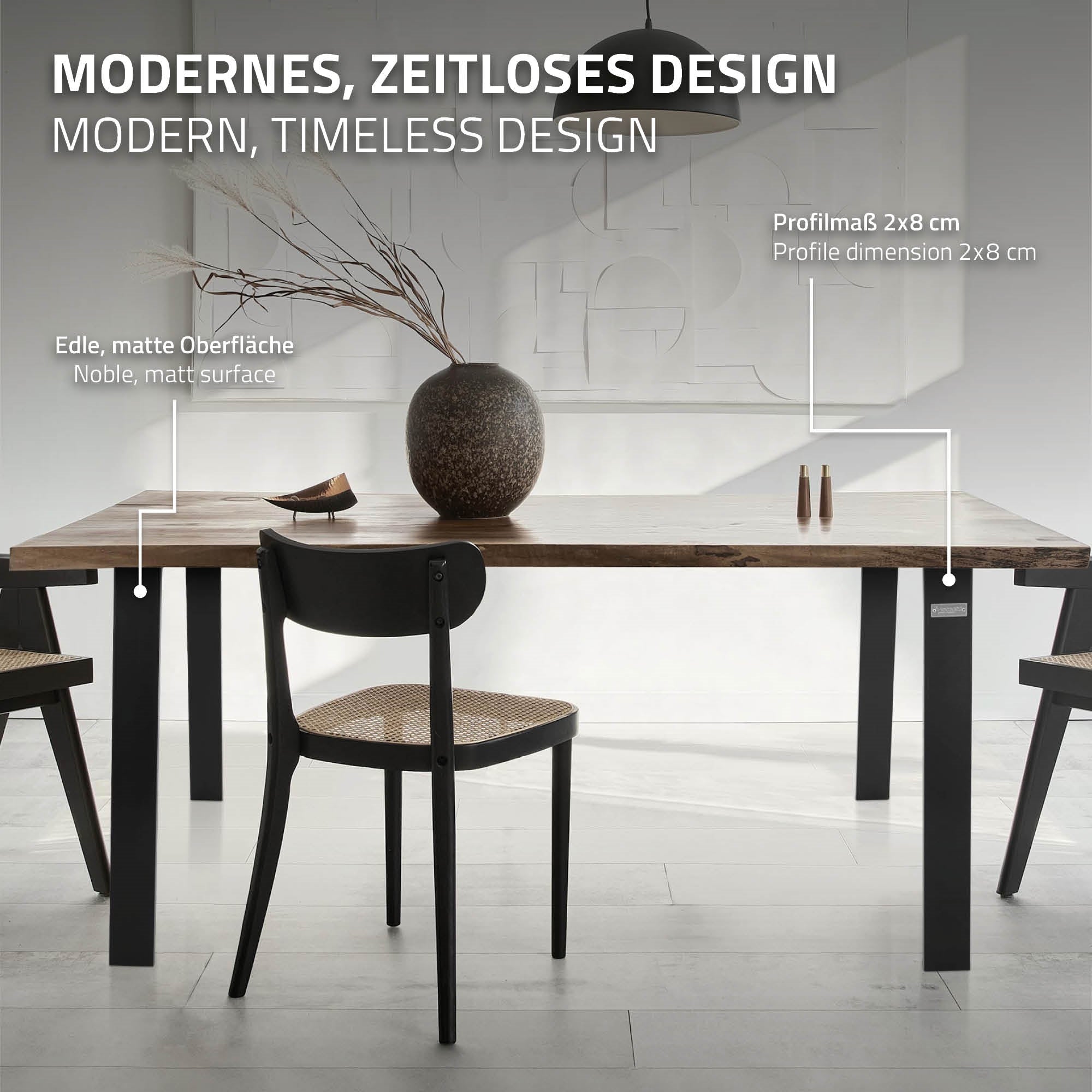Un tavolo con design moderno, sedie e un vaso sulla superficie del tavolo.