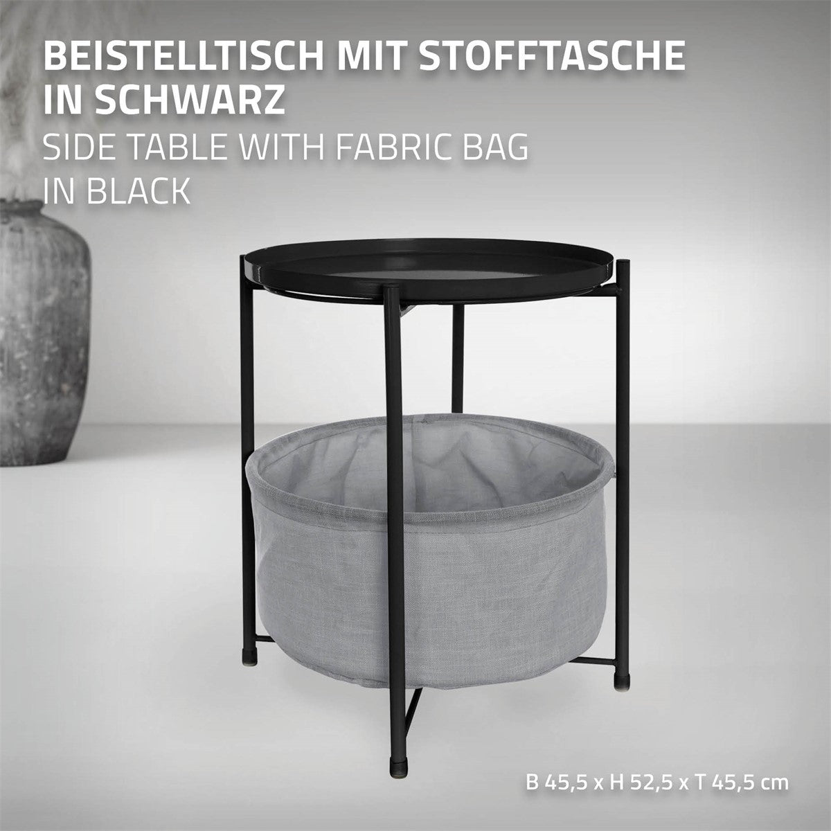 Schwarzer Beistelltisch mit Stofftasche, runde Tischplatte und abgerundete Beine.