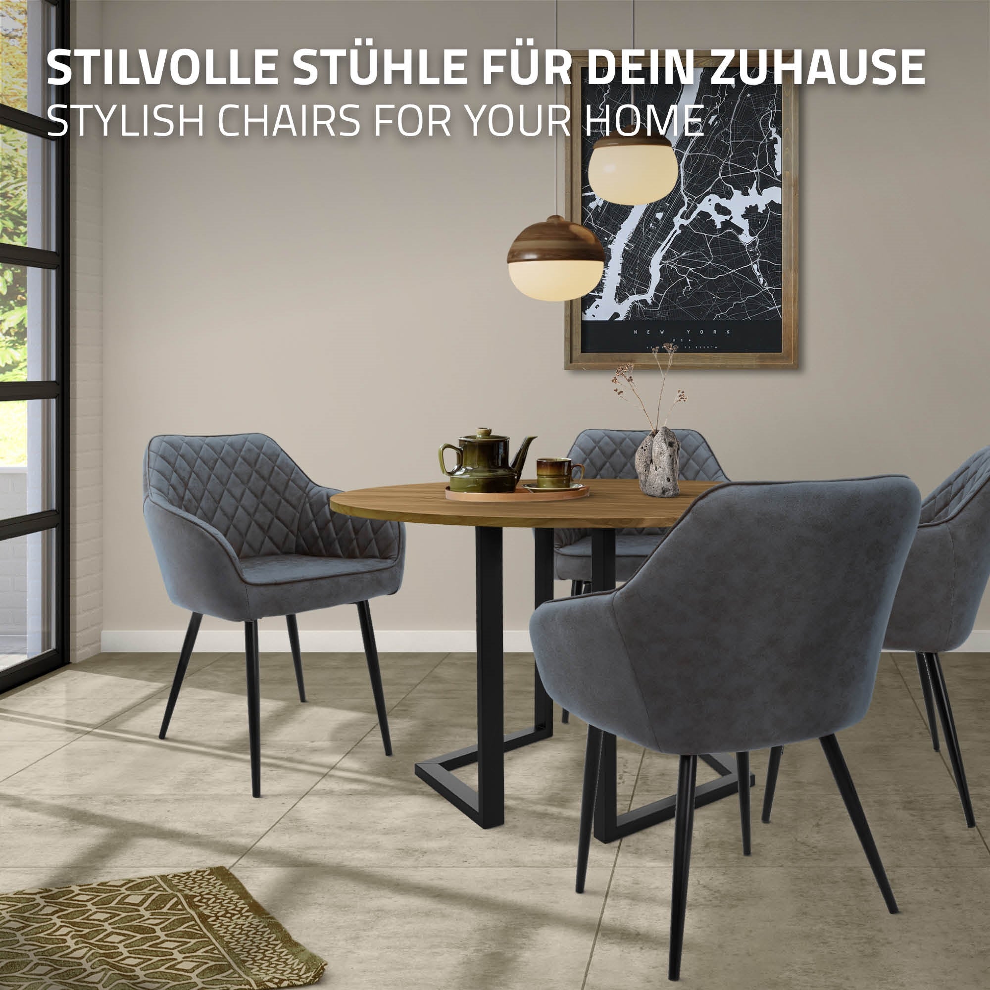 Ein runder Tisch mit vier grauen Stühlen in einem modernen Essbereich.