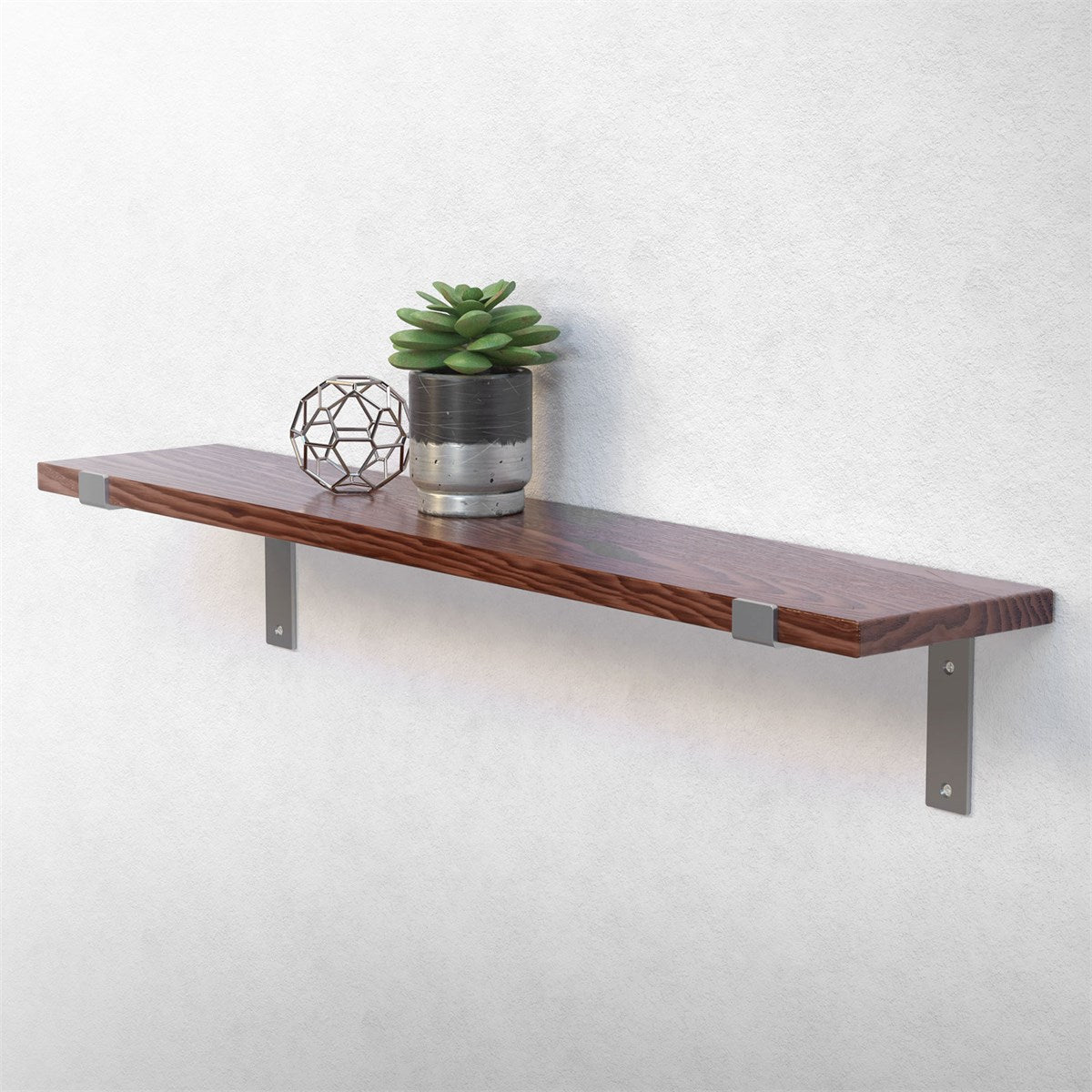 Wooden shelf with a plant and geometric decoration.
