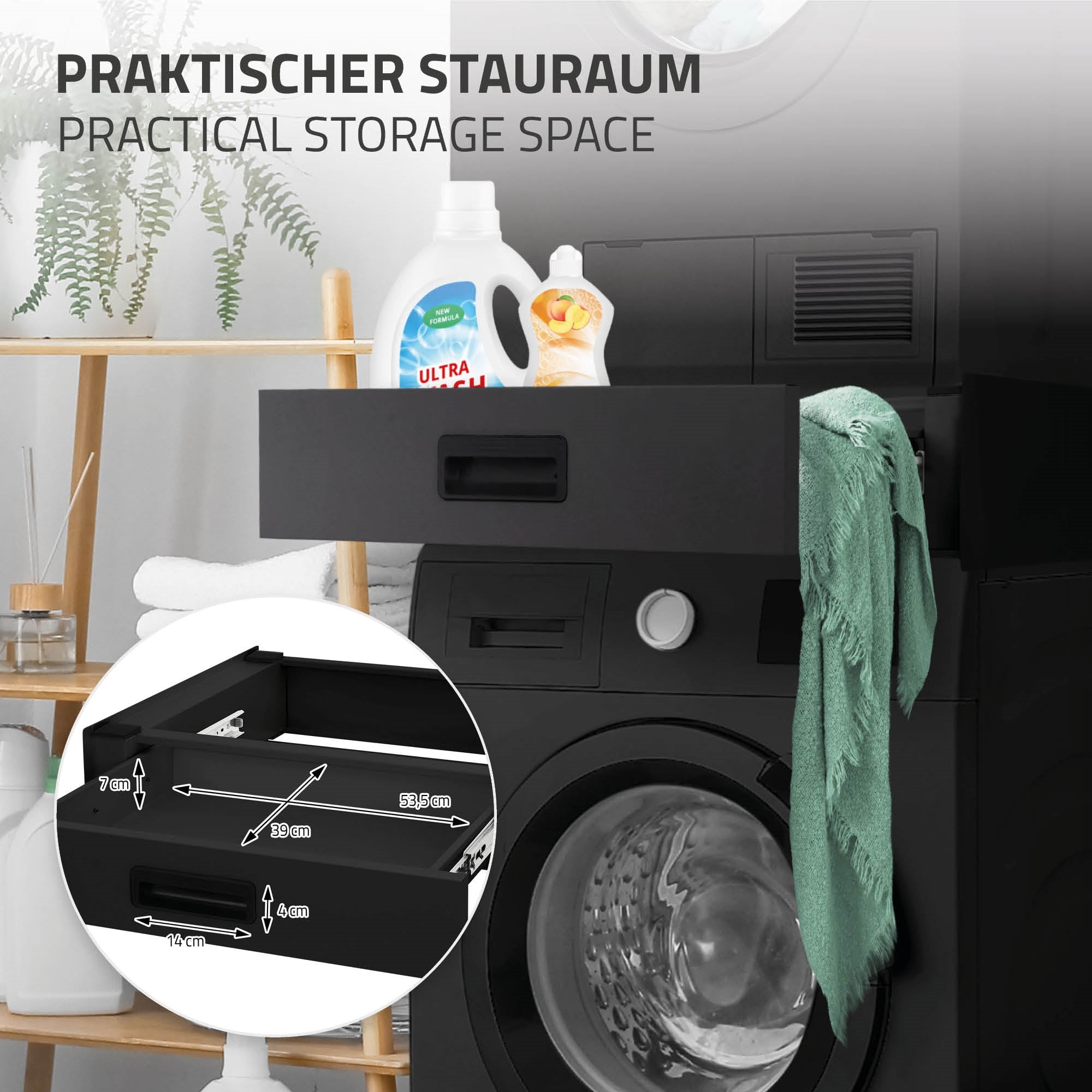 Schwarze Schublade mit Waschmittel und Handtuch, neben einer Waschmaschine.