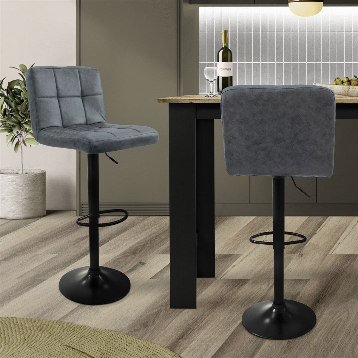Two gray bar stools at a table in a modern kitchen.