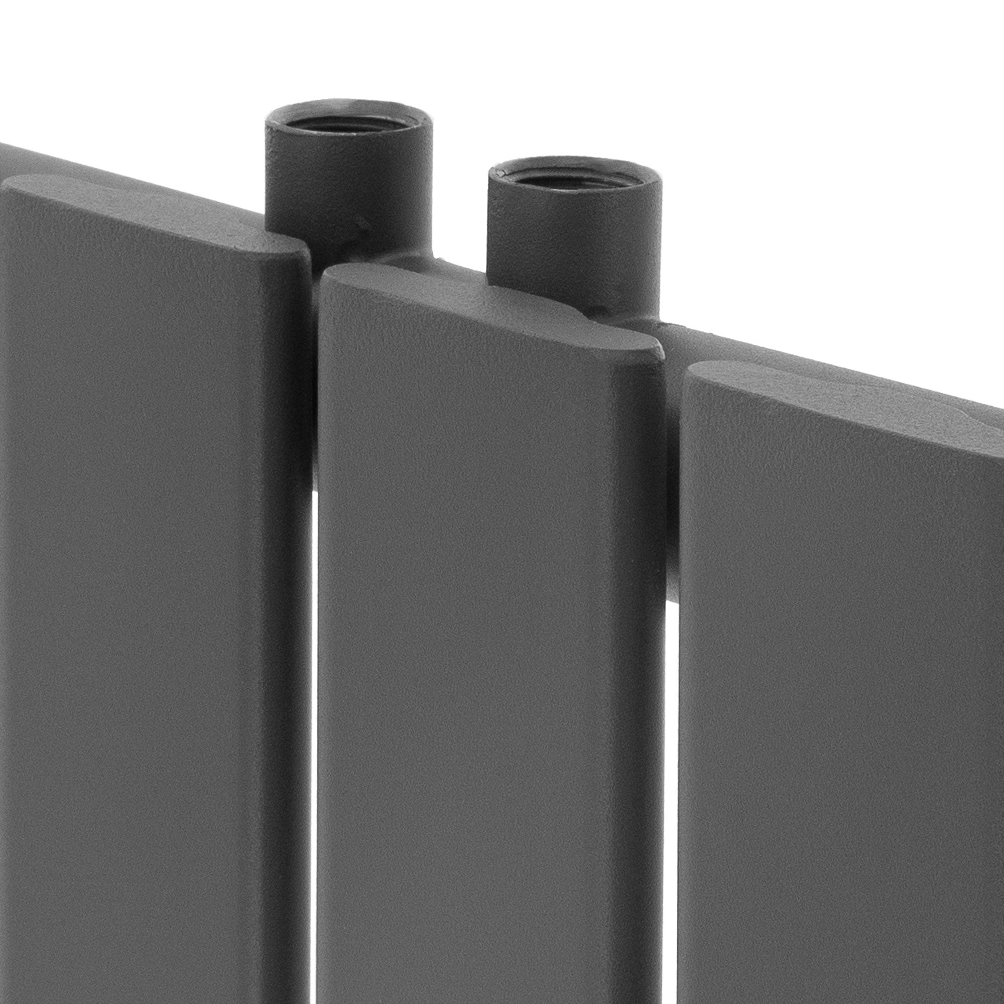 Close-up of the top side of a dark gray heating panel.