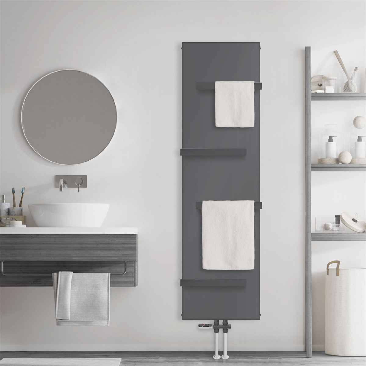 Anthracite-colored radiator with three towels in the bathroom.