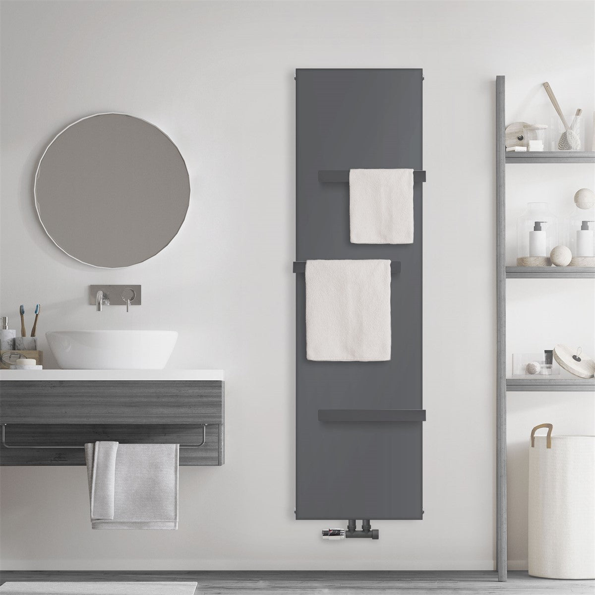 Anthracite-colored radiator with towels on a wall in a bathroom.