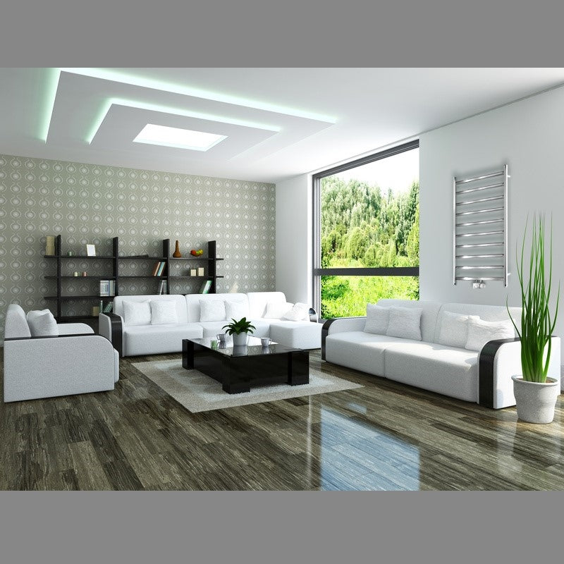 Bright living room with white sofas, table, and large windows.