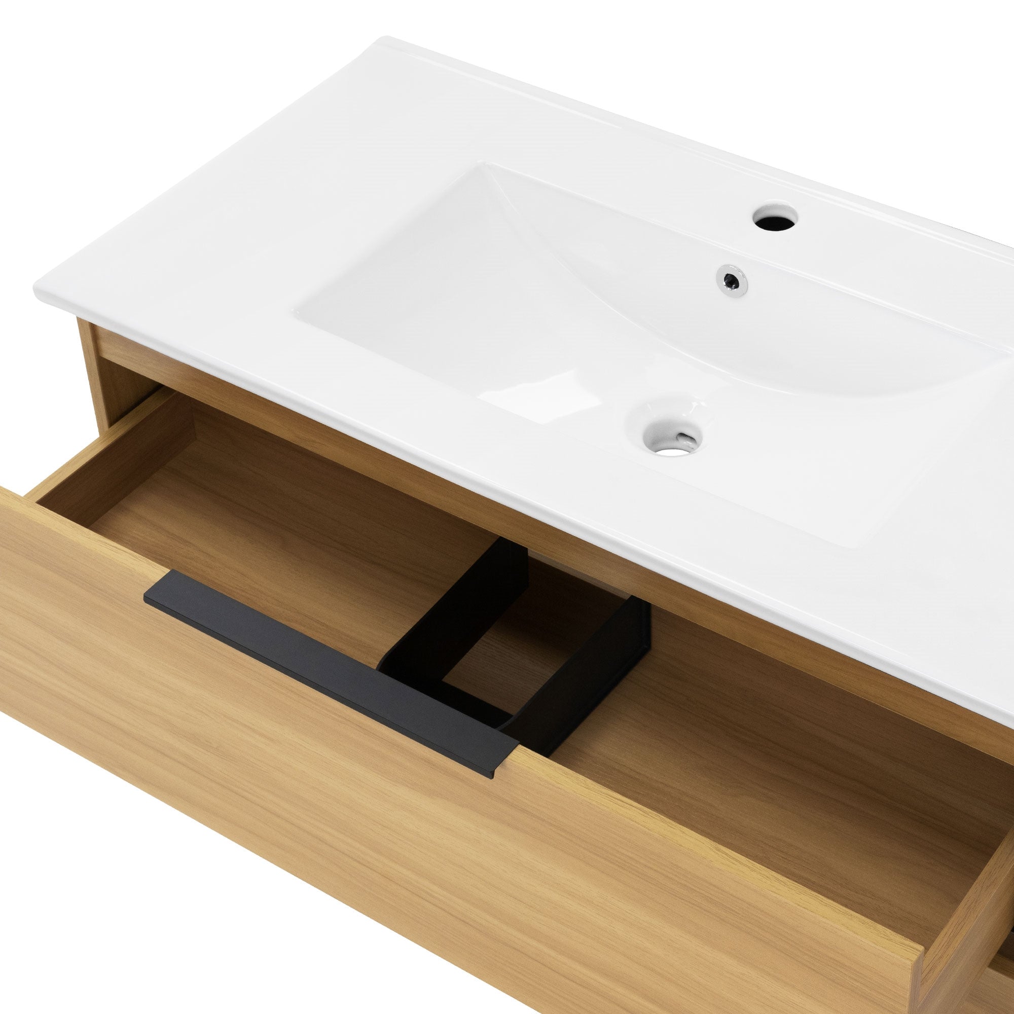 Detail view of a washbasin with an open drawer element.