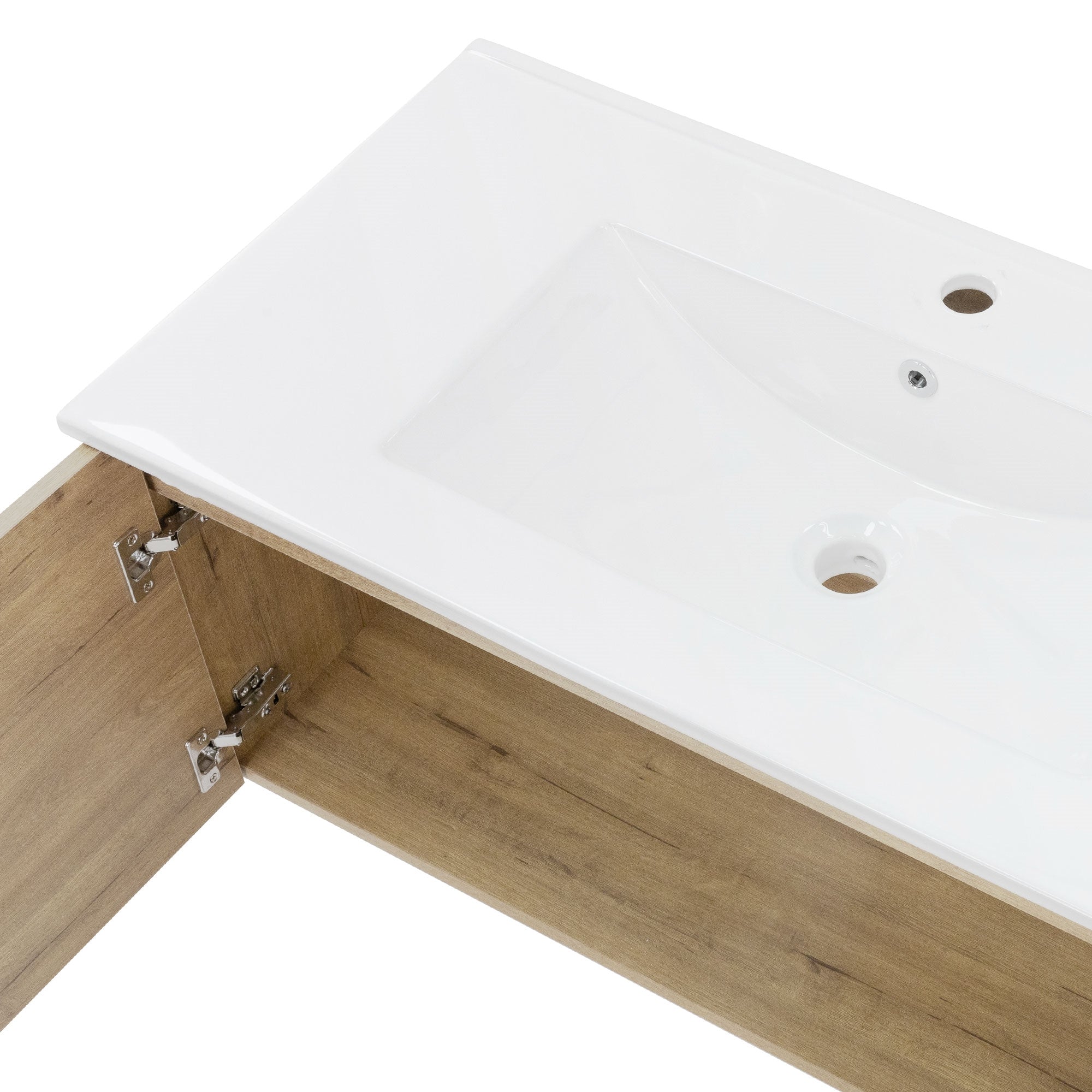 Vista dall'alto di un lavabo con una vasca bianca e base in legno.