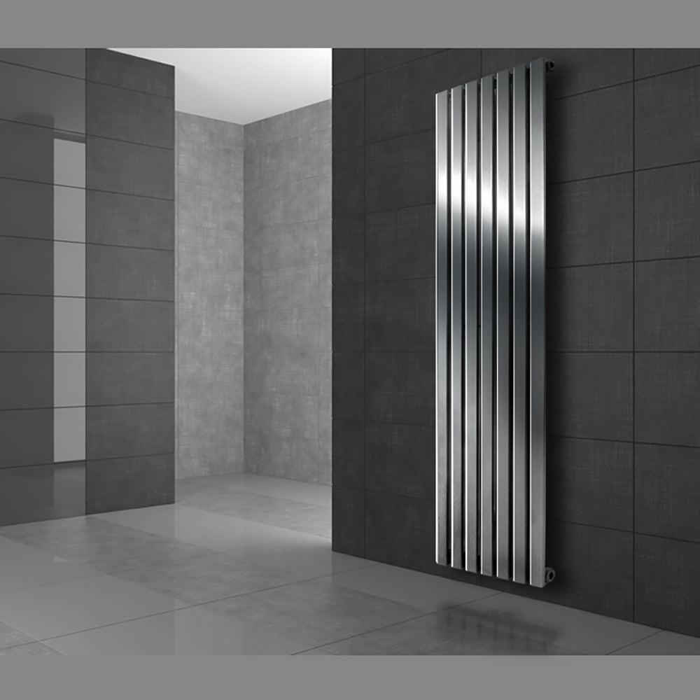 Modern silver radiator with vertical fins in a room.