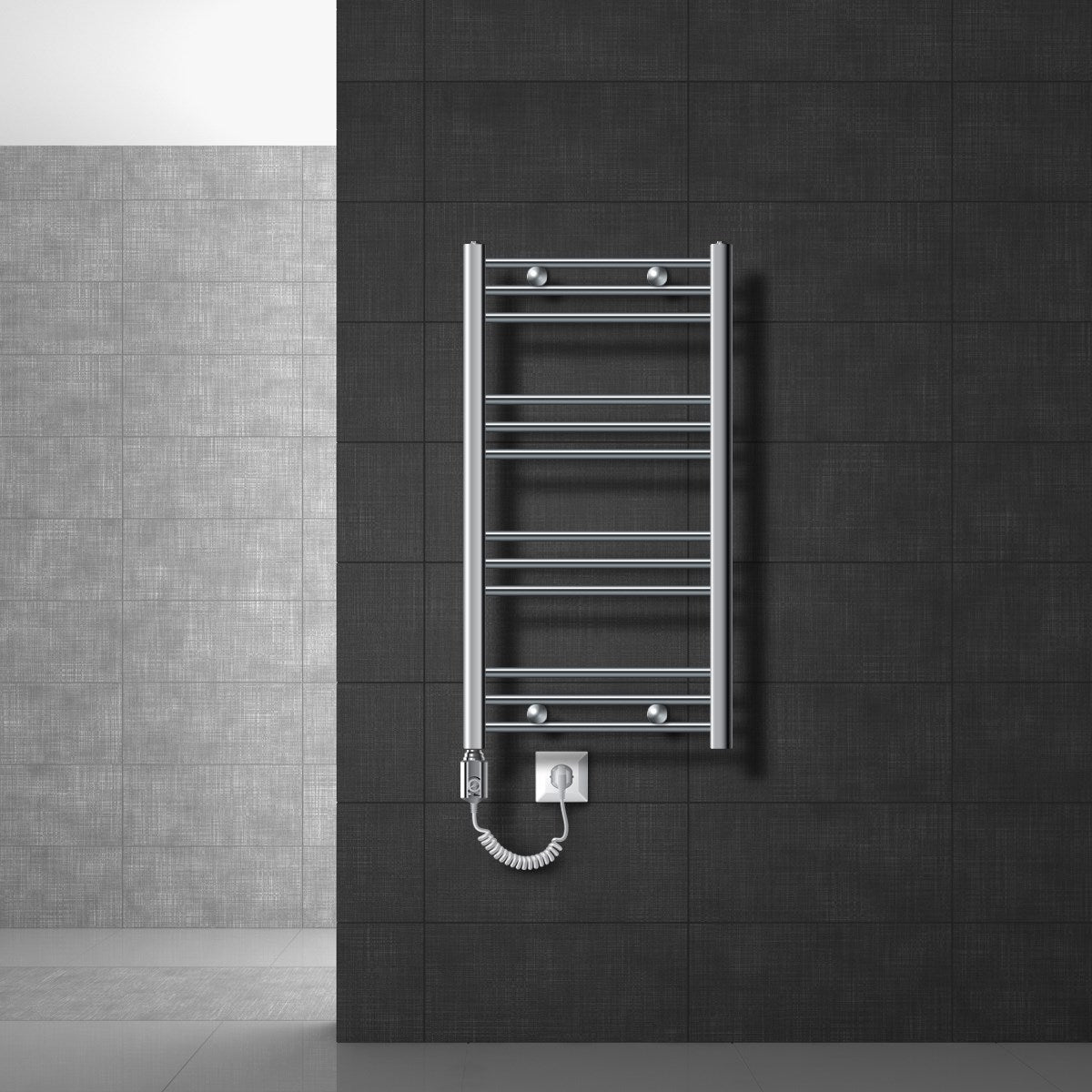 A low electric towel radiator with a plug on a wall.