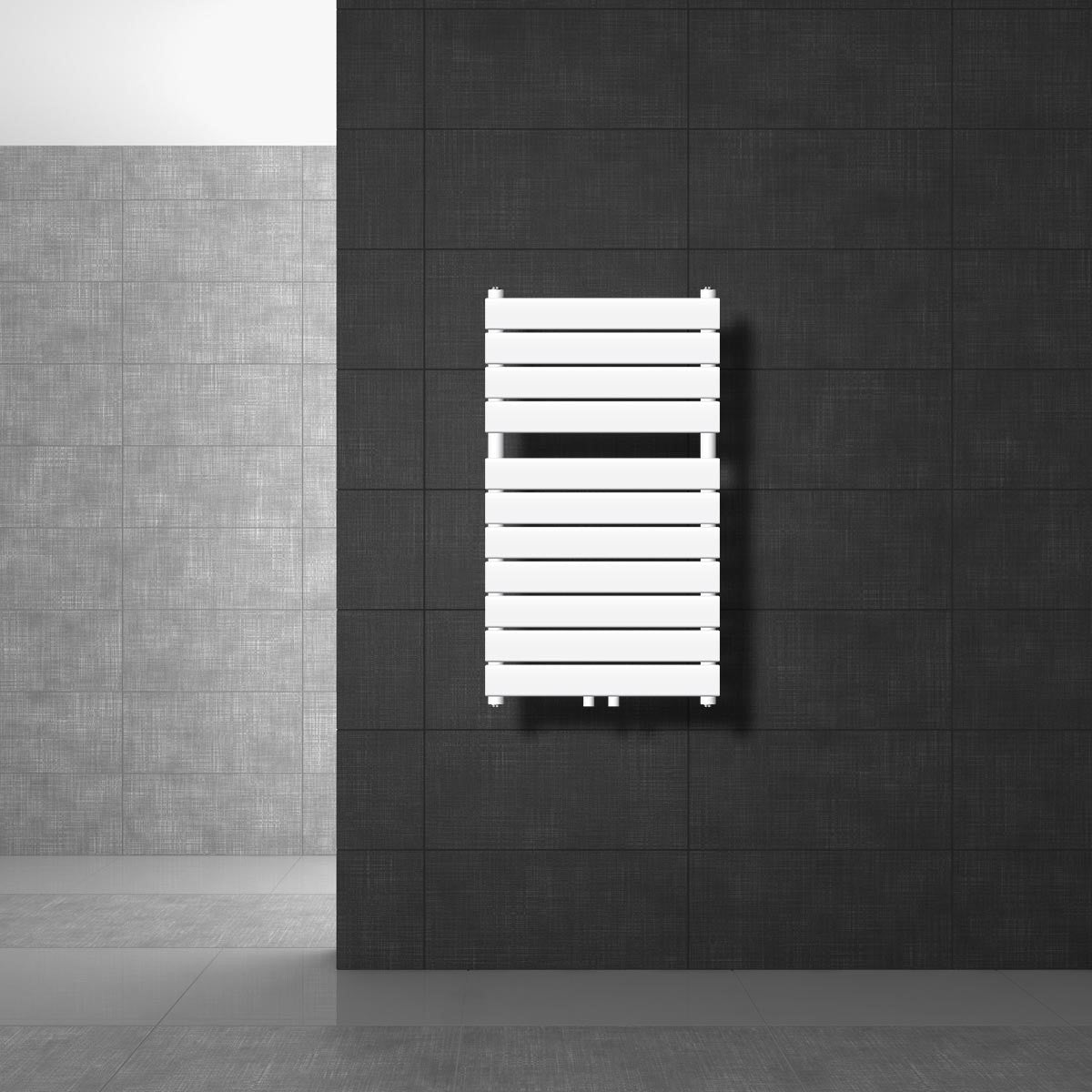 White radiator on a dark wall, with no visible pipes.