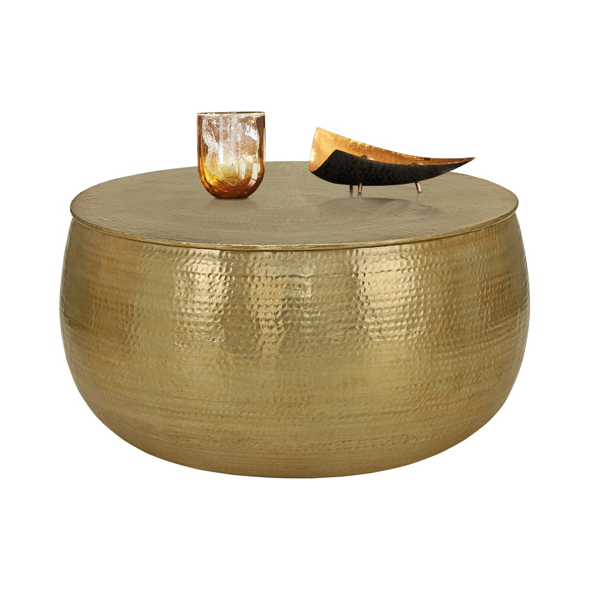 Round gold-coloured table with a glass vase and a decorative object.