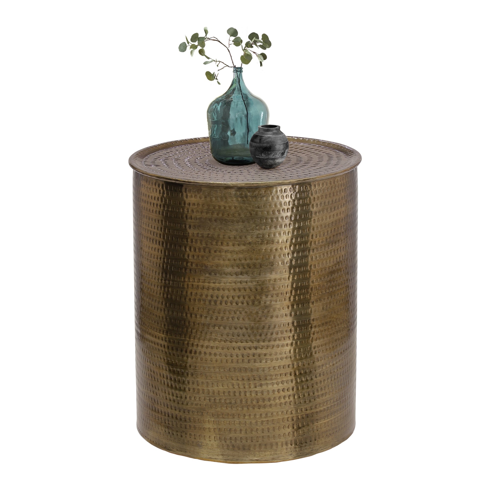 Round gold-colored side table with a glass vase and a small bowl on top.