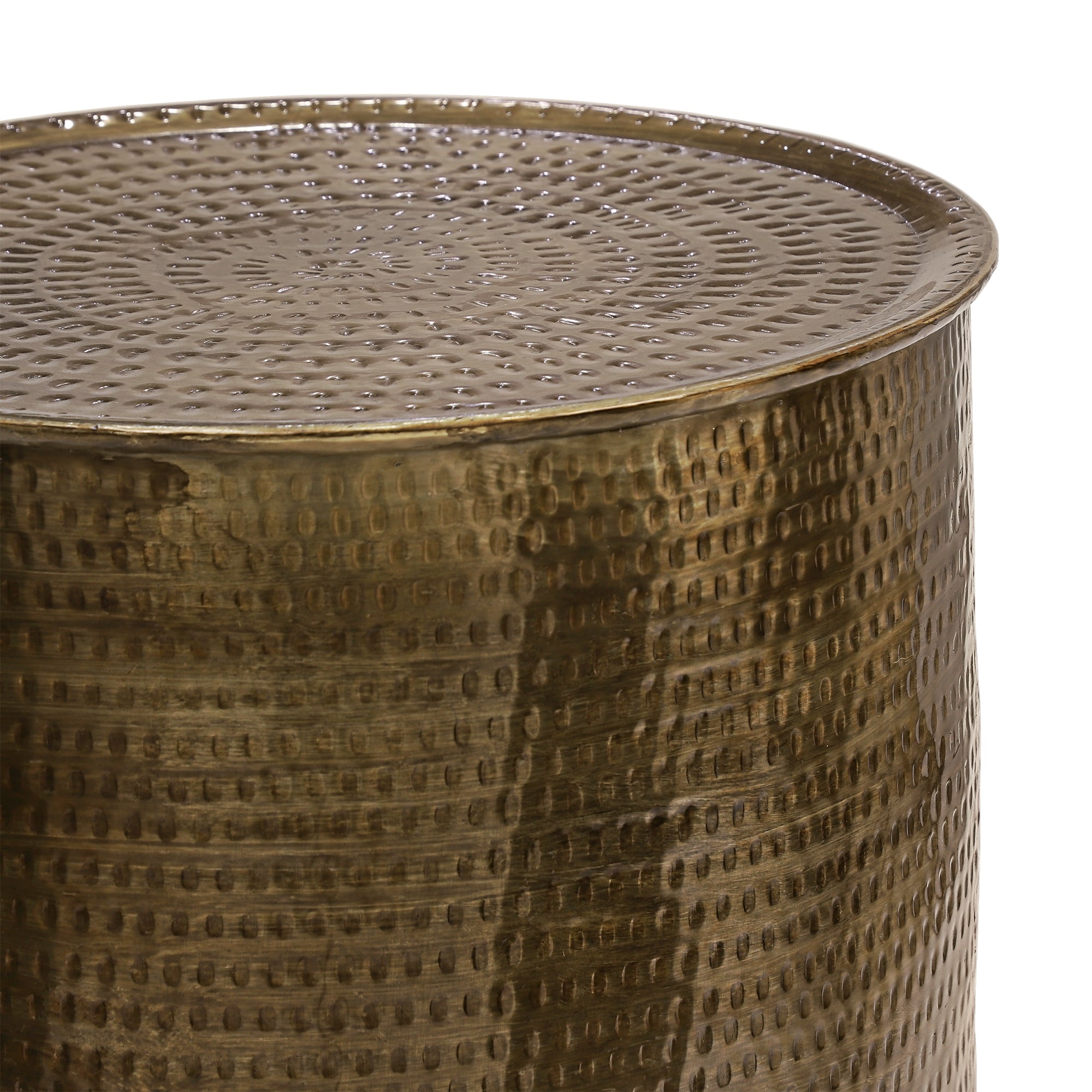 Round gold-colored side table with a textured surface.