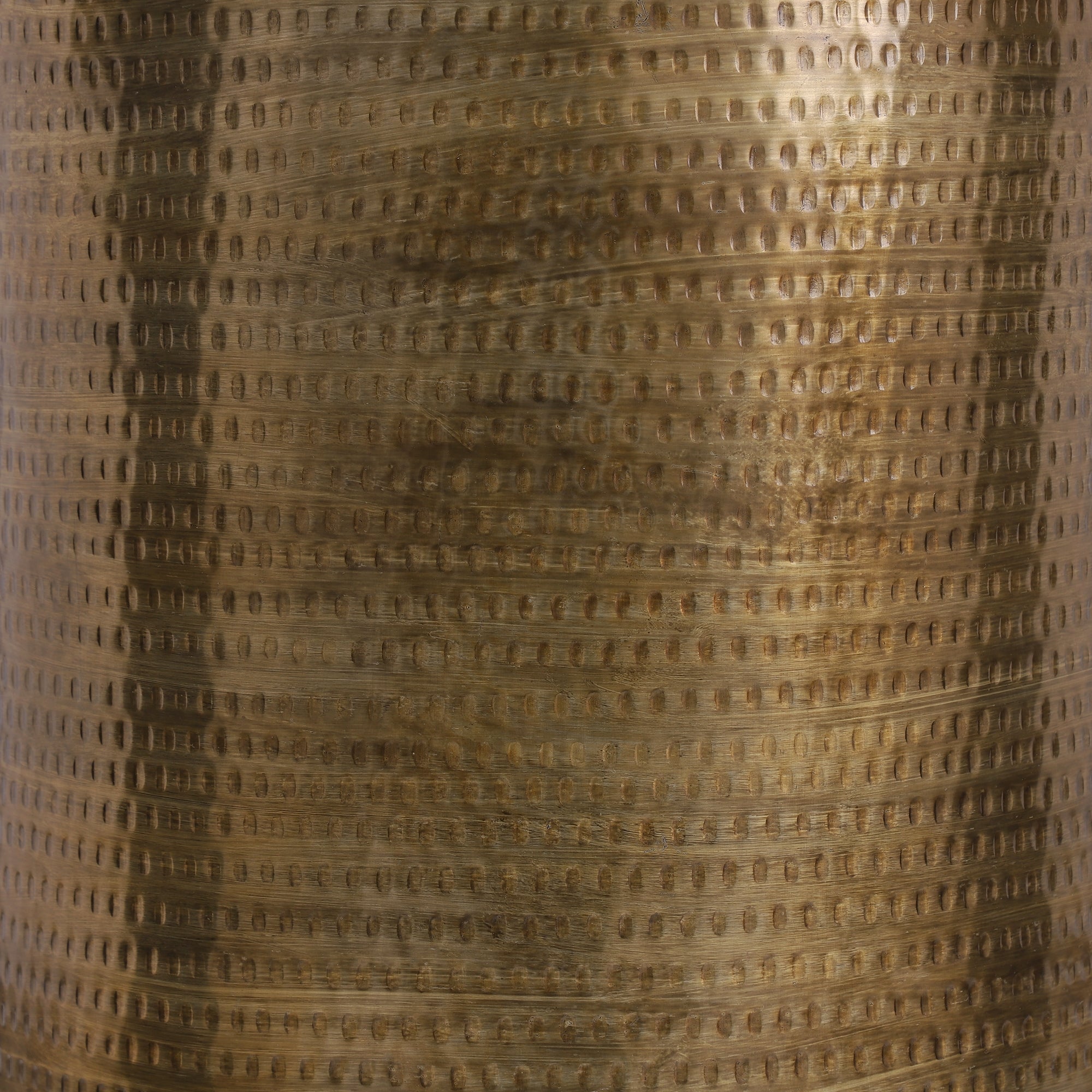 Close-up of a gold-colored, textured surface.