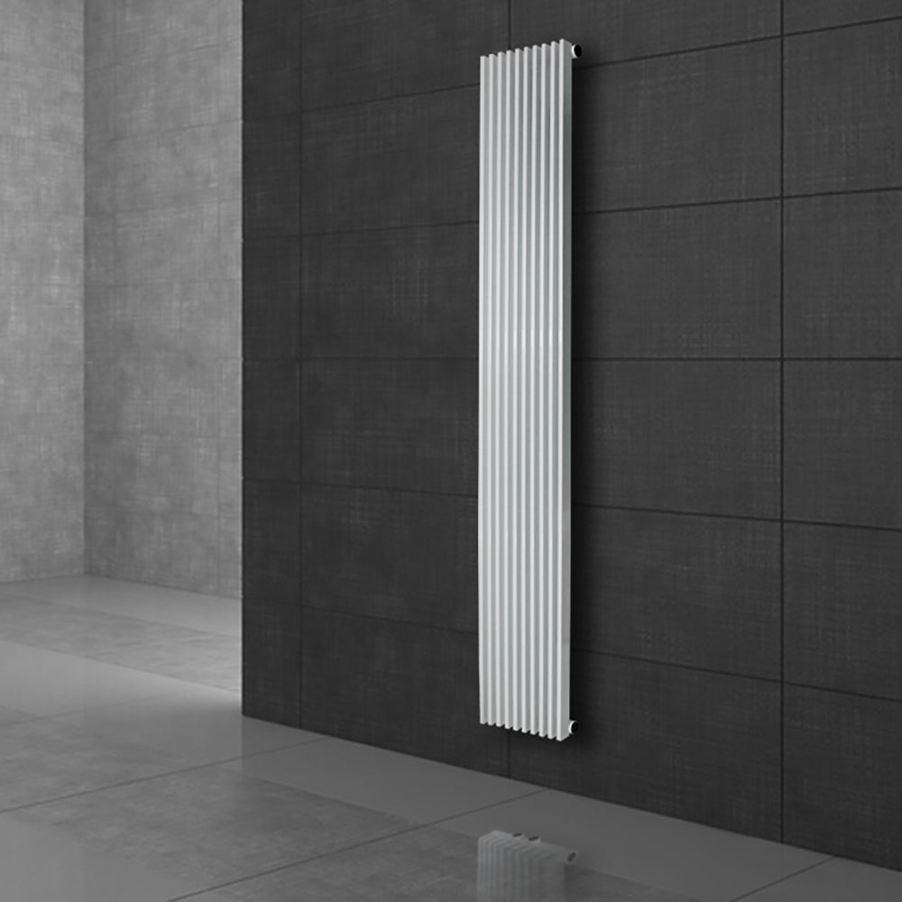 White radiator against a gray wall.