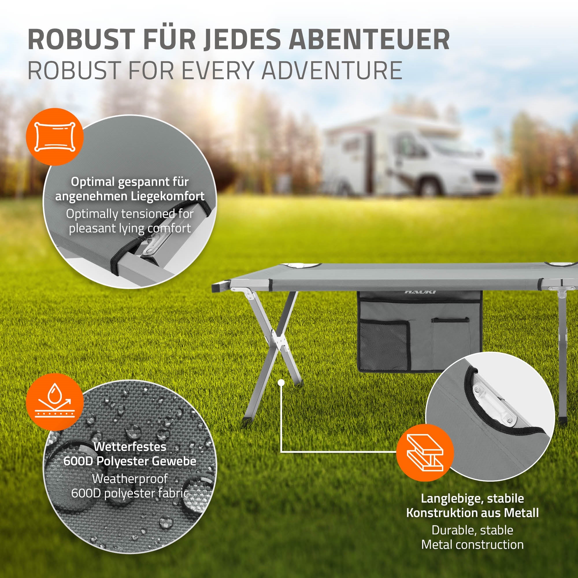 Campingbett in grauer Farbe, auf einer Wiese aufgestellt.