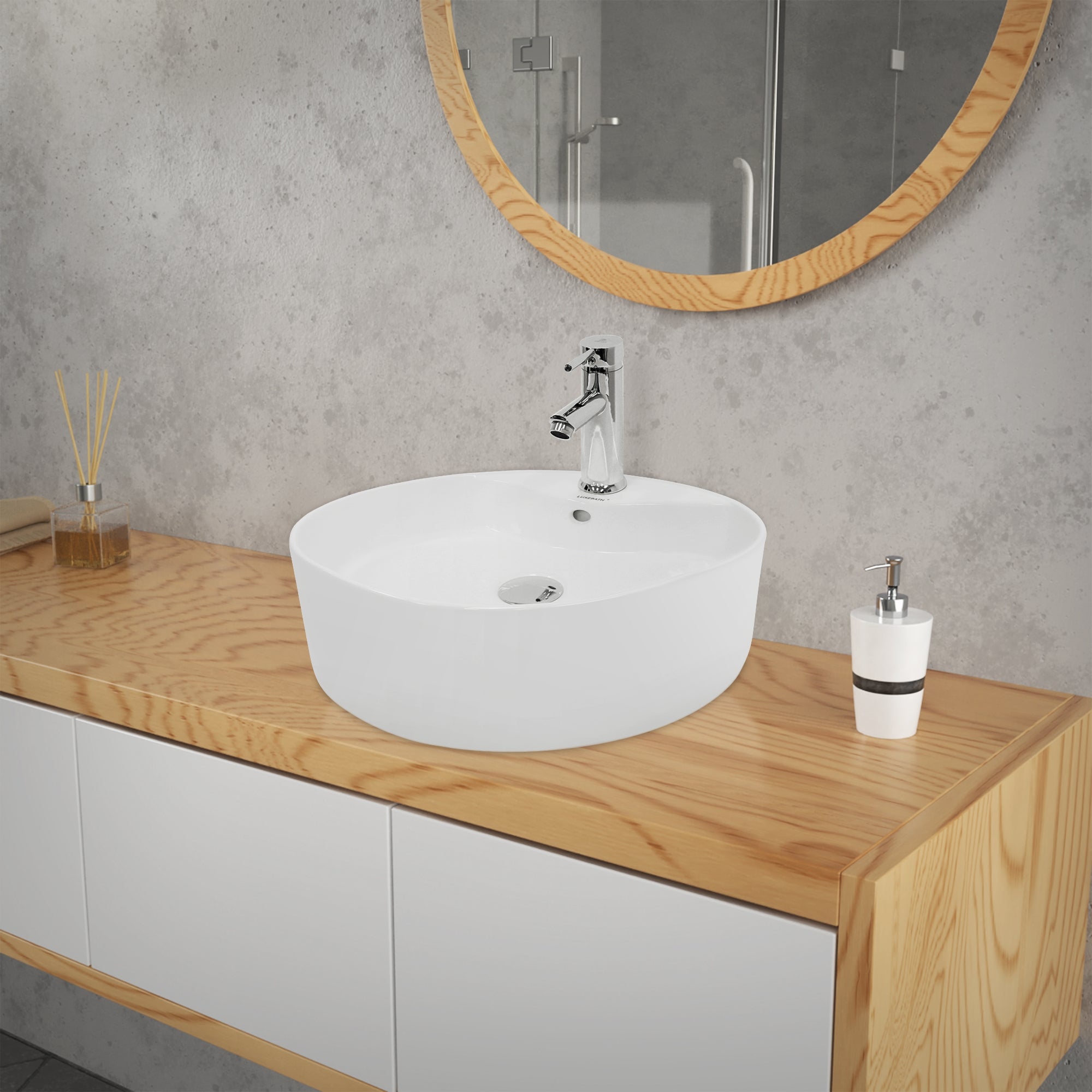 Round, white sink on a wooden washstand with soap dispenser.