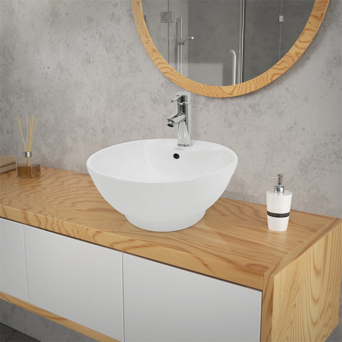 Close-up of a round washbasin on a wooden vanity top.