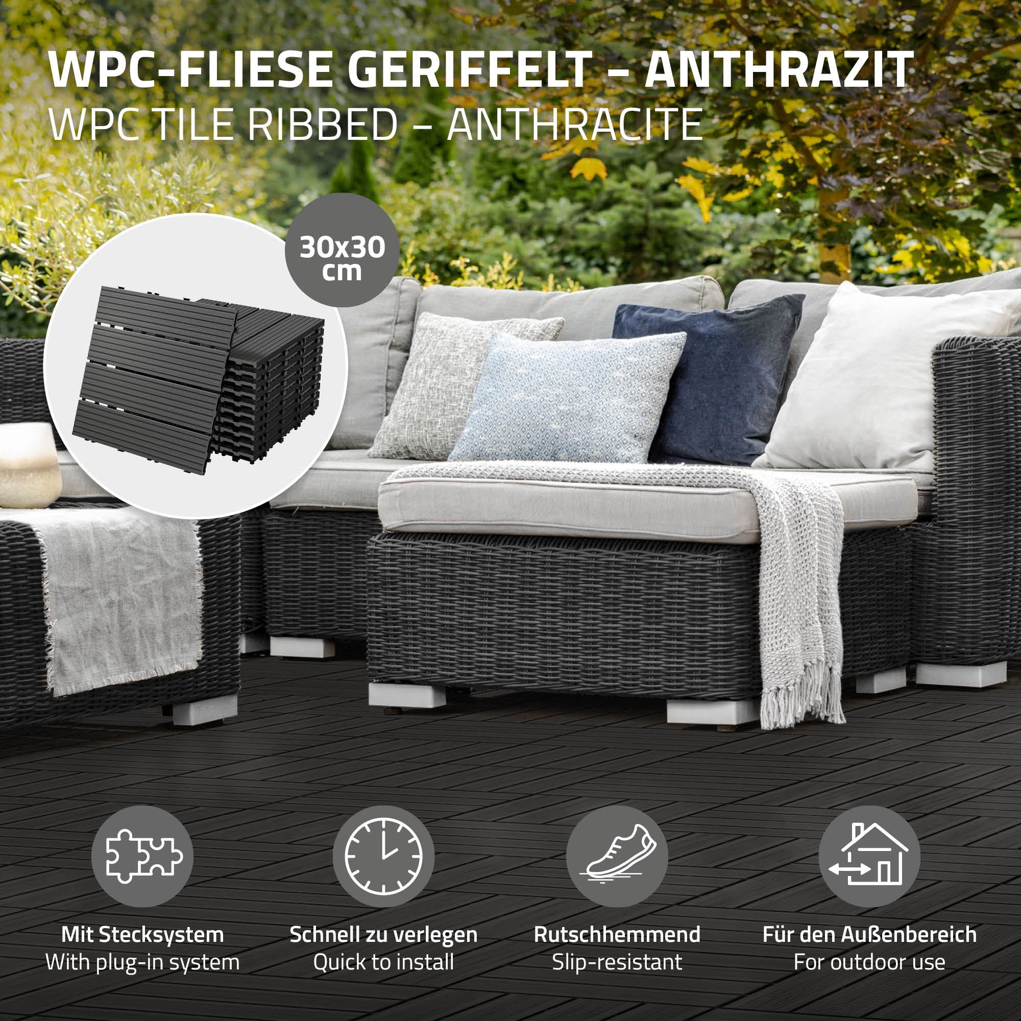 WPC-Fliese in Anthrazit mit Sofa und Kissen auf einer Terrasse.