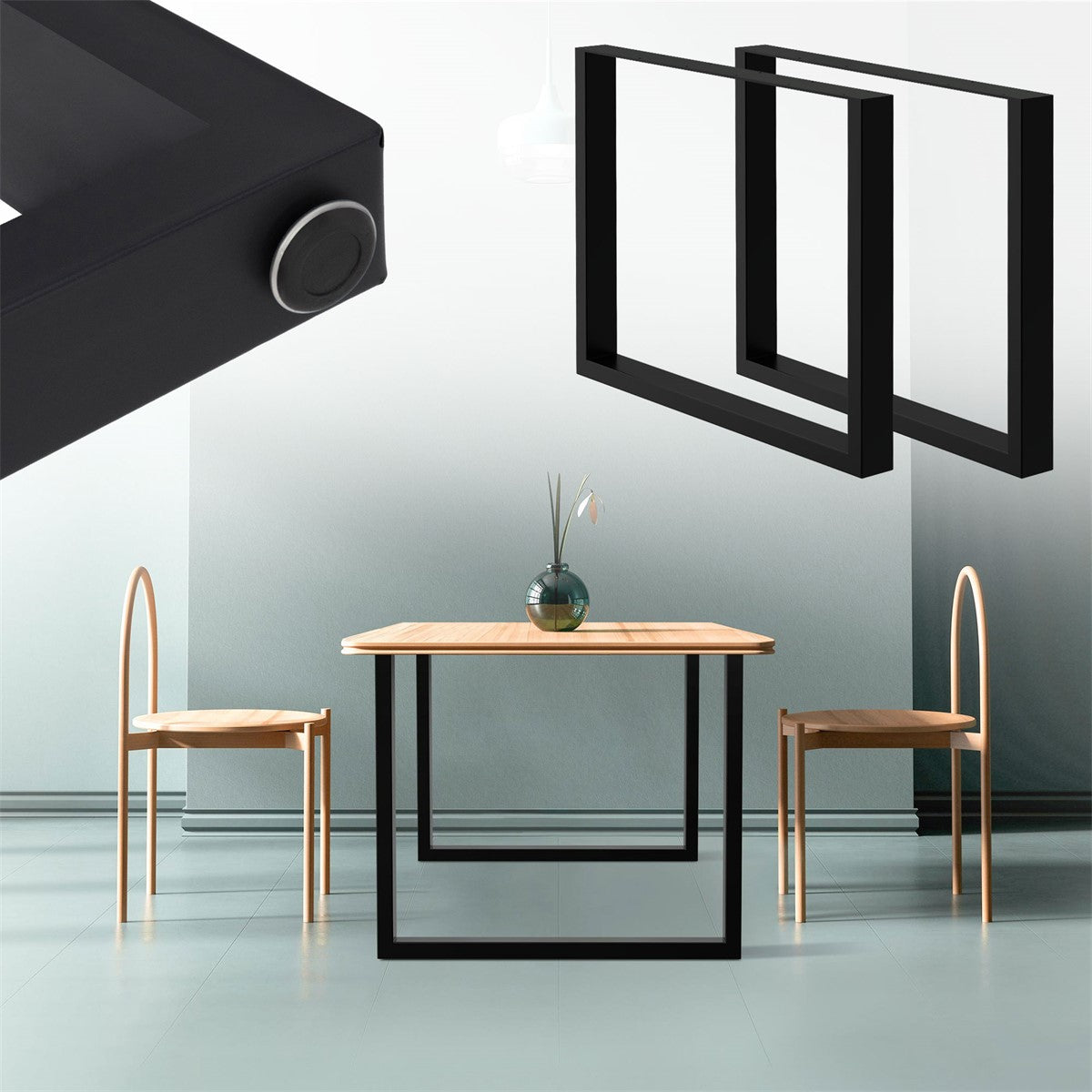 A table with a wooden tabletop and black metal legs, two chairs in the background.